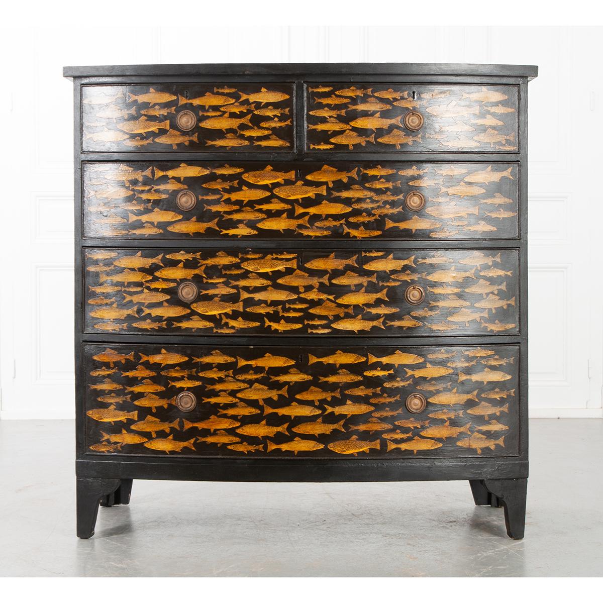 A playful twist on an antique pine chest of drawers. Recently painted black with a fish decoupage design. This chest will add a whimsical flair to any room in your house, especially a bedroom as there is plenty of storage inside its five drawers,
