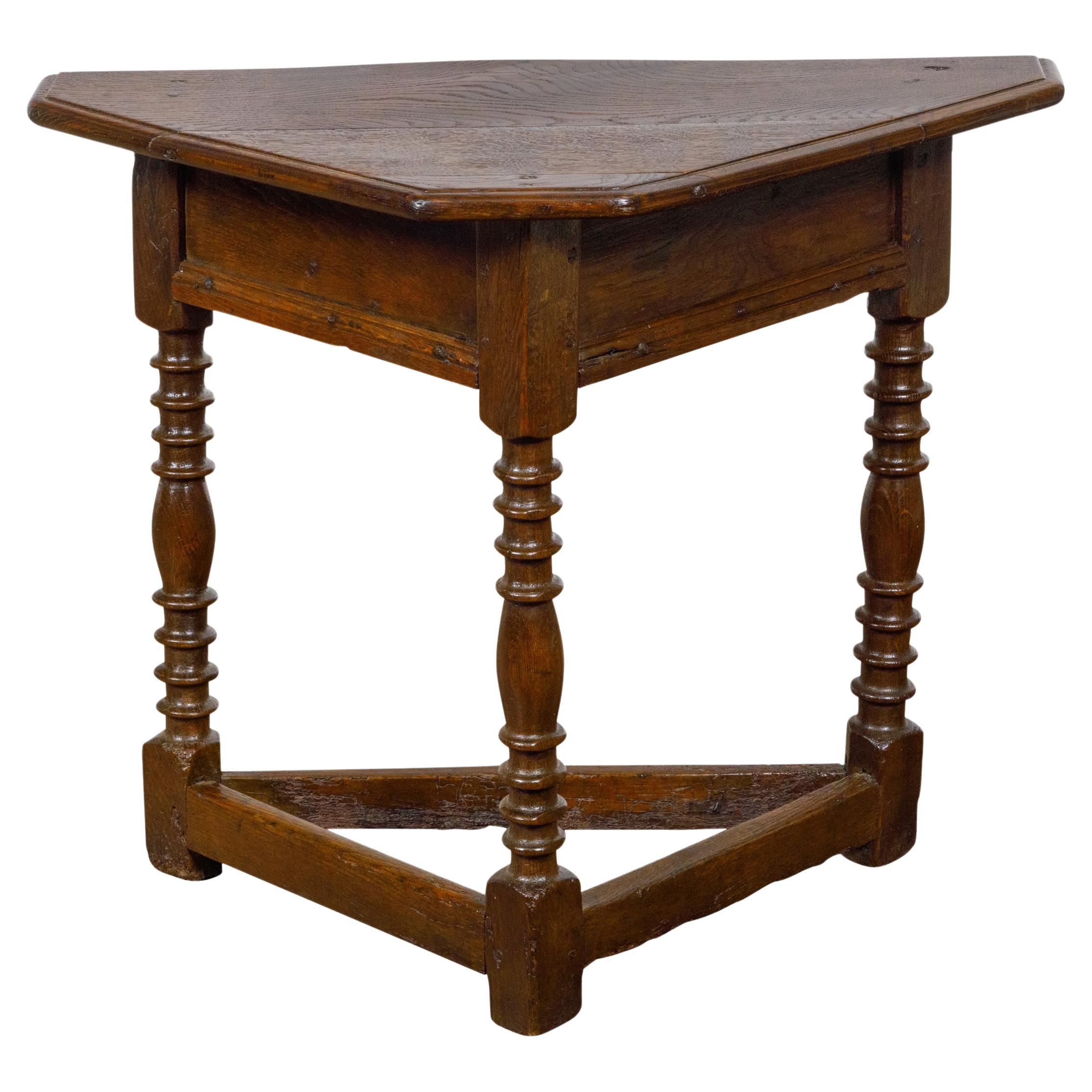 English 19th Century Dark Oak Triangular Demilune Table with Turned Legs For Sale