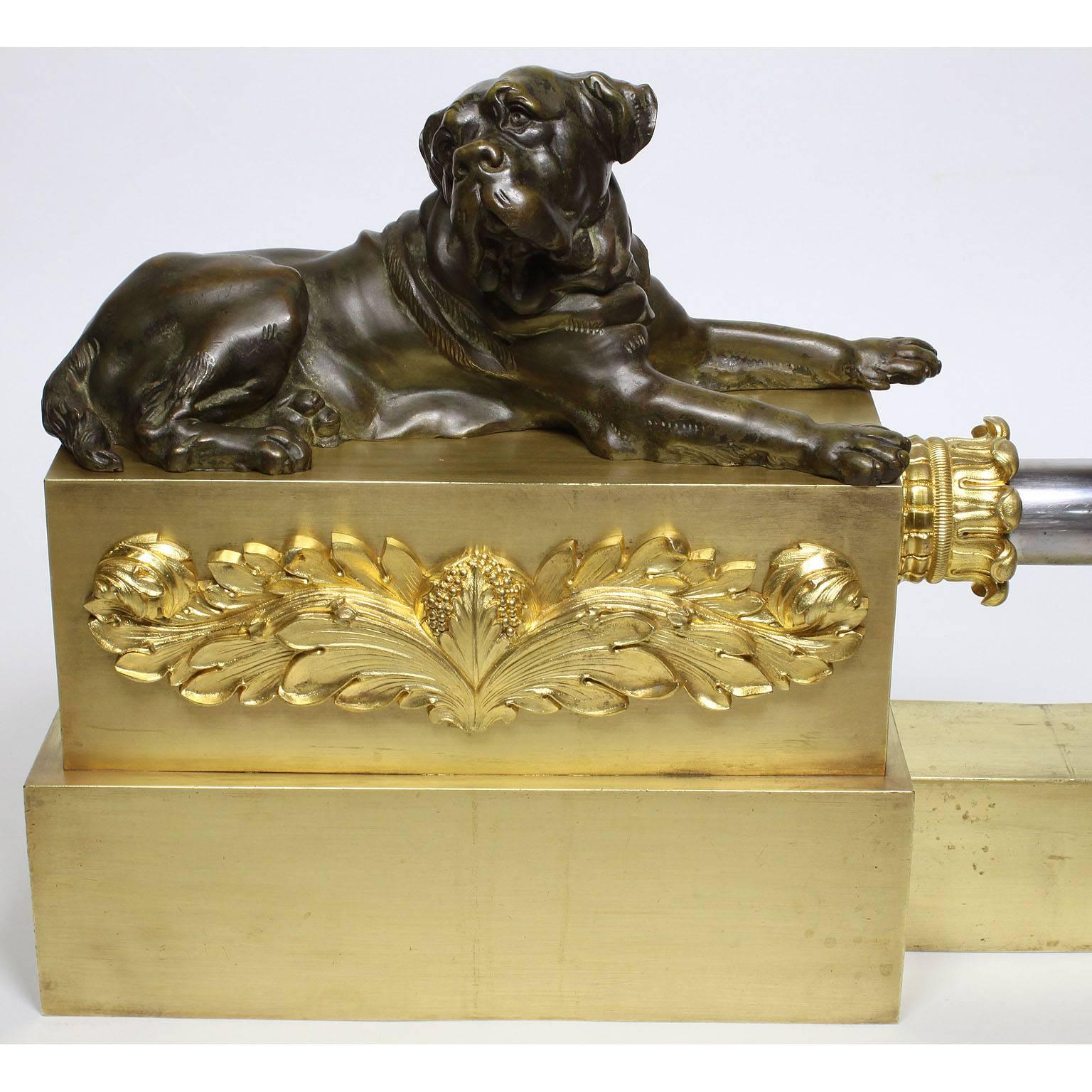 A very fine and large English 19th century Empire style gilt and patinated bronze and steel figural fireplace fender - chenet. The beautifully designed fender flanked on each end by resting Bull Mastiff dogs on a patinated rectangular plinth