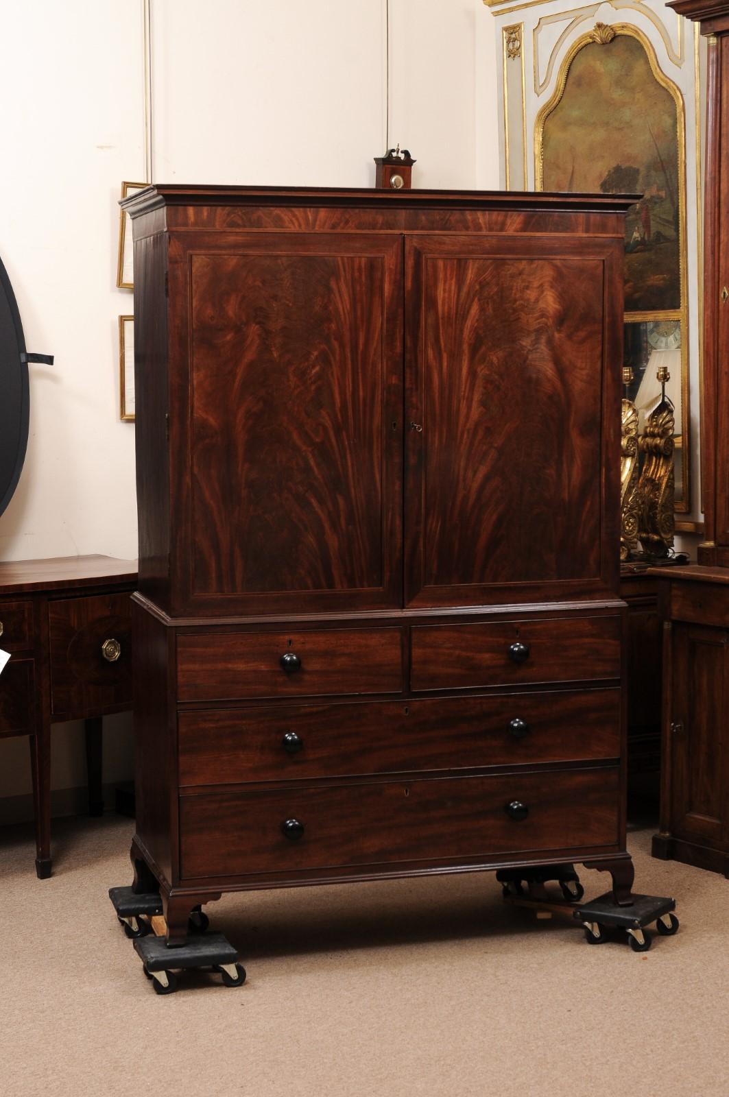 English 19th Century Figured Mahogany Linen Press with Flat Moulded Cornice, Ebonized Wooden Pulls and Splayed Feet