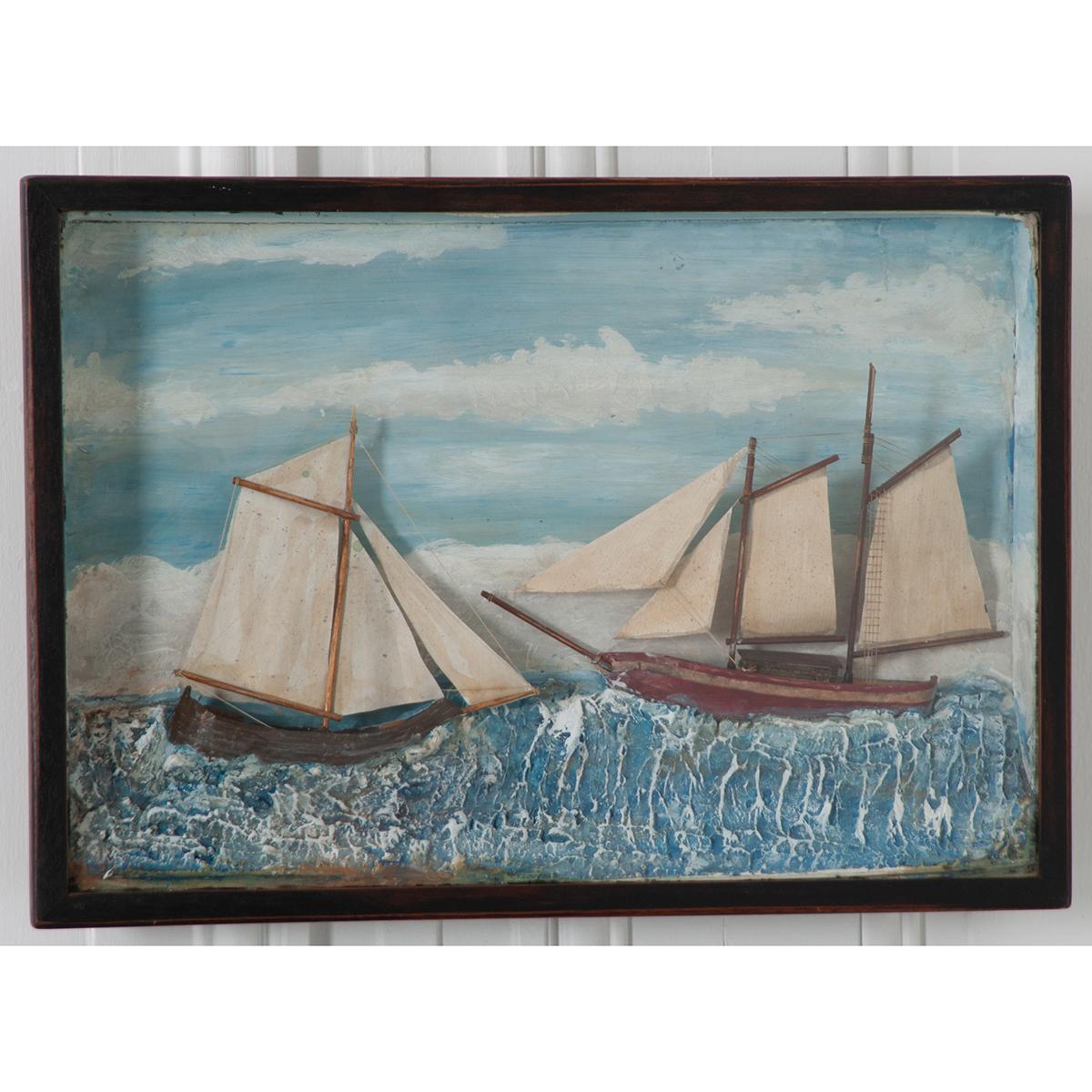 A brilliant English 19th century nautically themed diorama featuring two boats with sails. These three dimensional works of art were typically made by sailors in the 19th century. Note the meticulously detailed sails, masts, ropes, and netting.
 