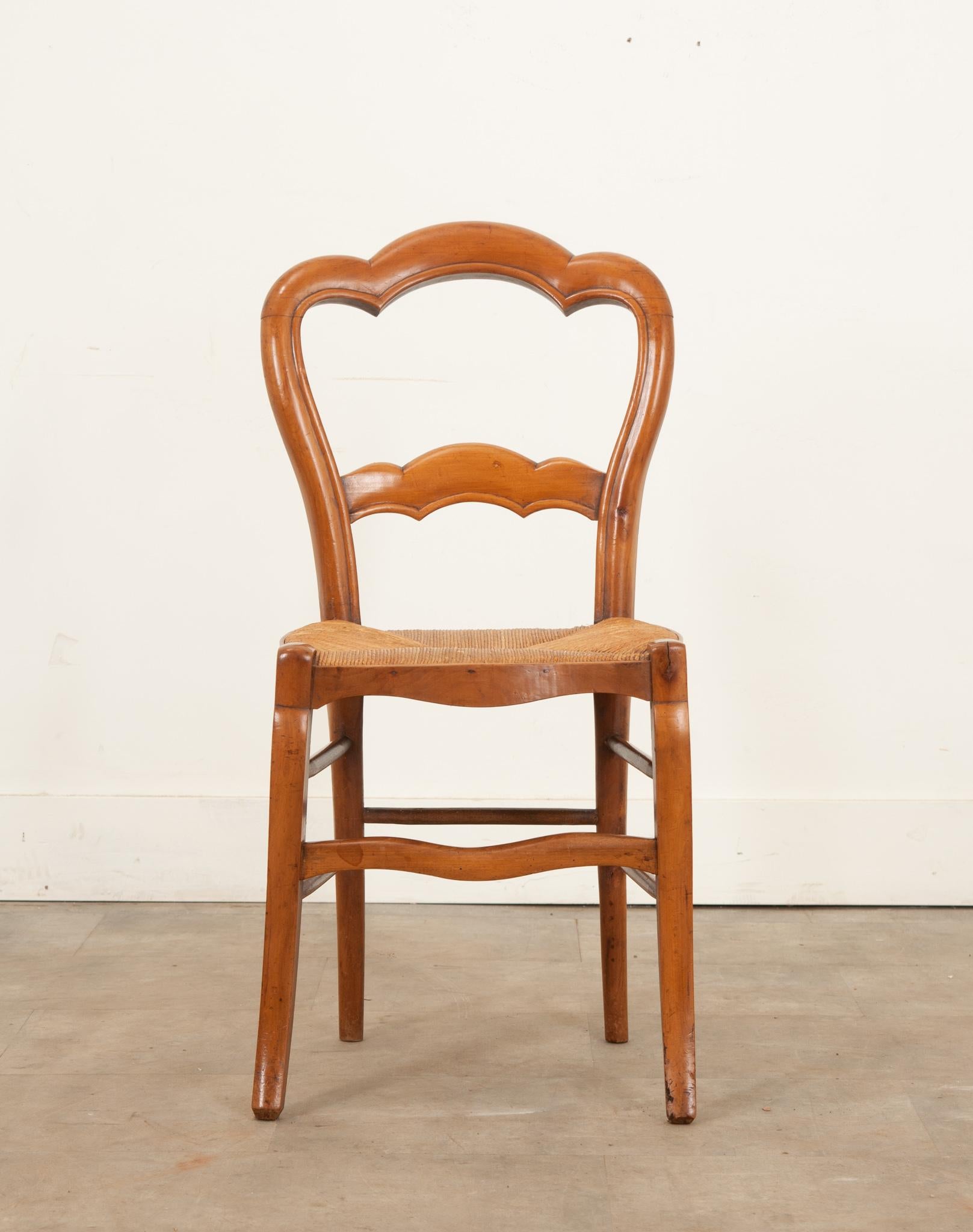 Country English 19th century fruitwood chair with a rush seat For Sale