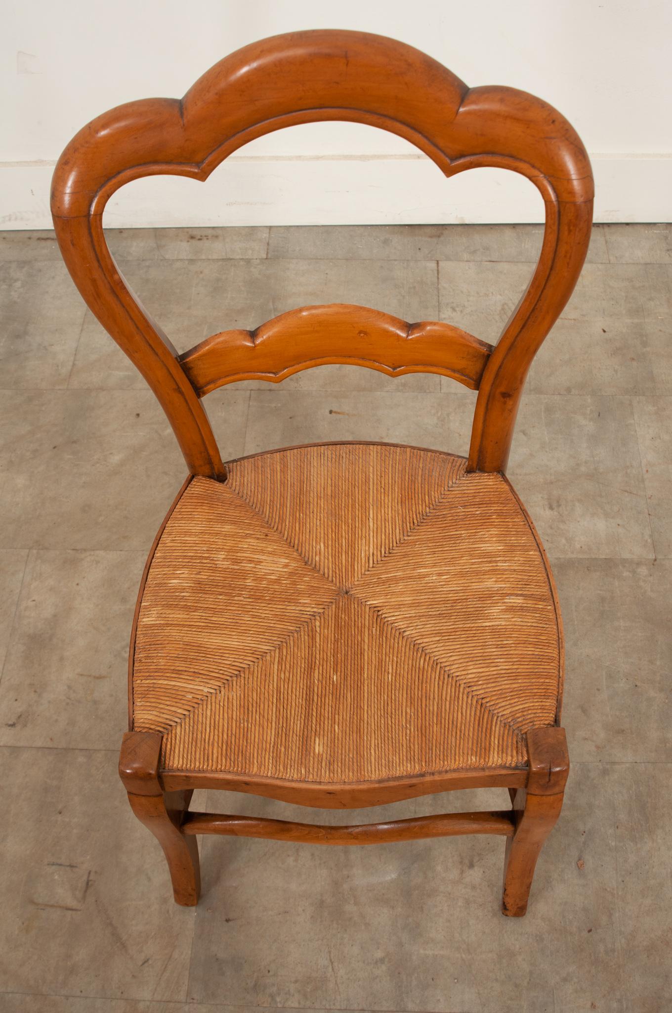 Hand-Crafted English 19th century fruitwood chair with a rush seat For Sale
