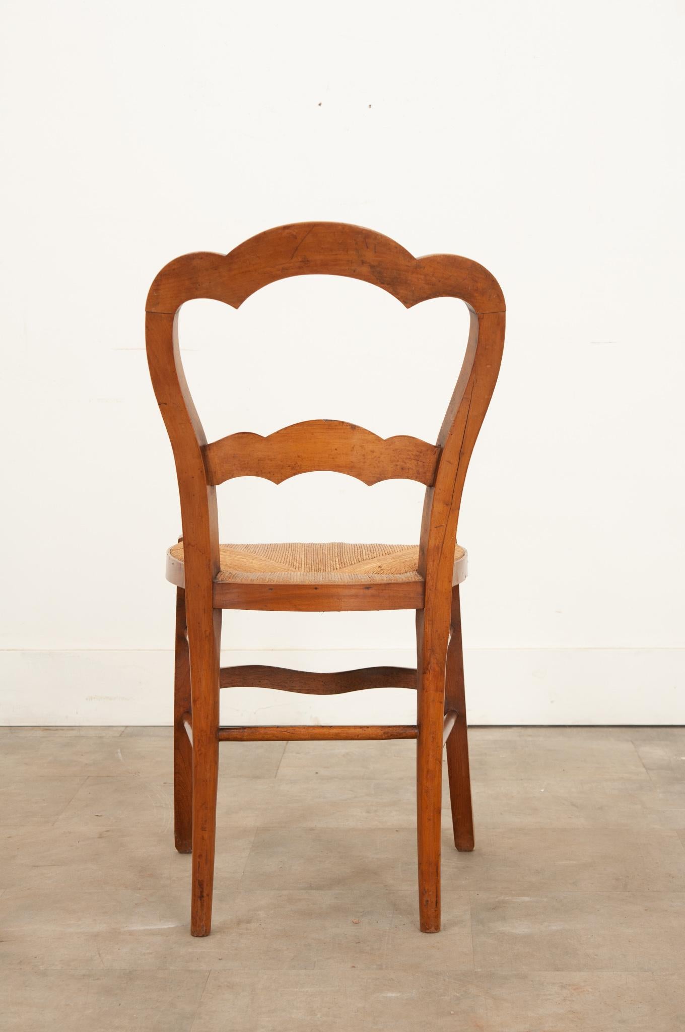 19th Century English 19th century fruitwood chair with a rush seat For Sale