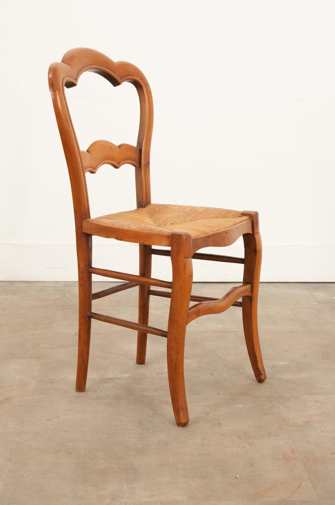 Rush English 19th century fruitwood chair with a rush seat For Sale