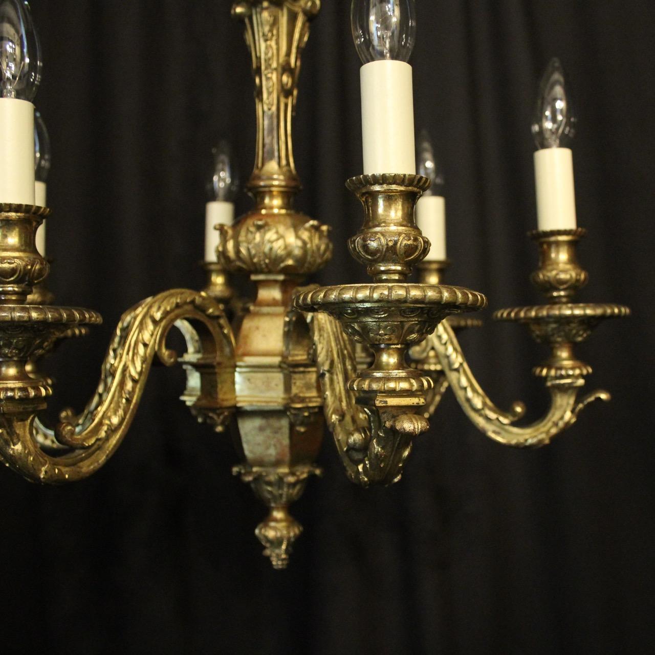 An English gilded cast bronze 6-light antique chandelier, the ornate leaf scrolling arms with circular bobeche drip pans and bulbous candle sconces, issuing from a tapering central column with lovely sectional leaf base, super quality casting with