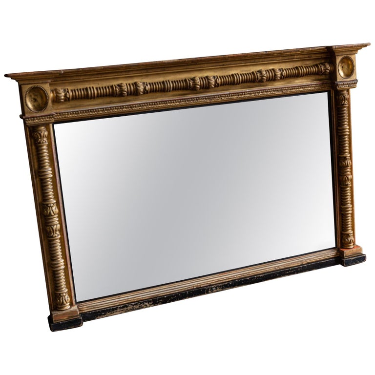 English 19th Century Gilt and Ebonized Bevelled Overmantle Mirror For Sale