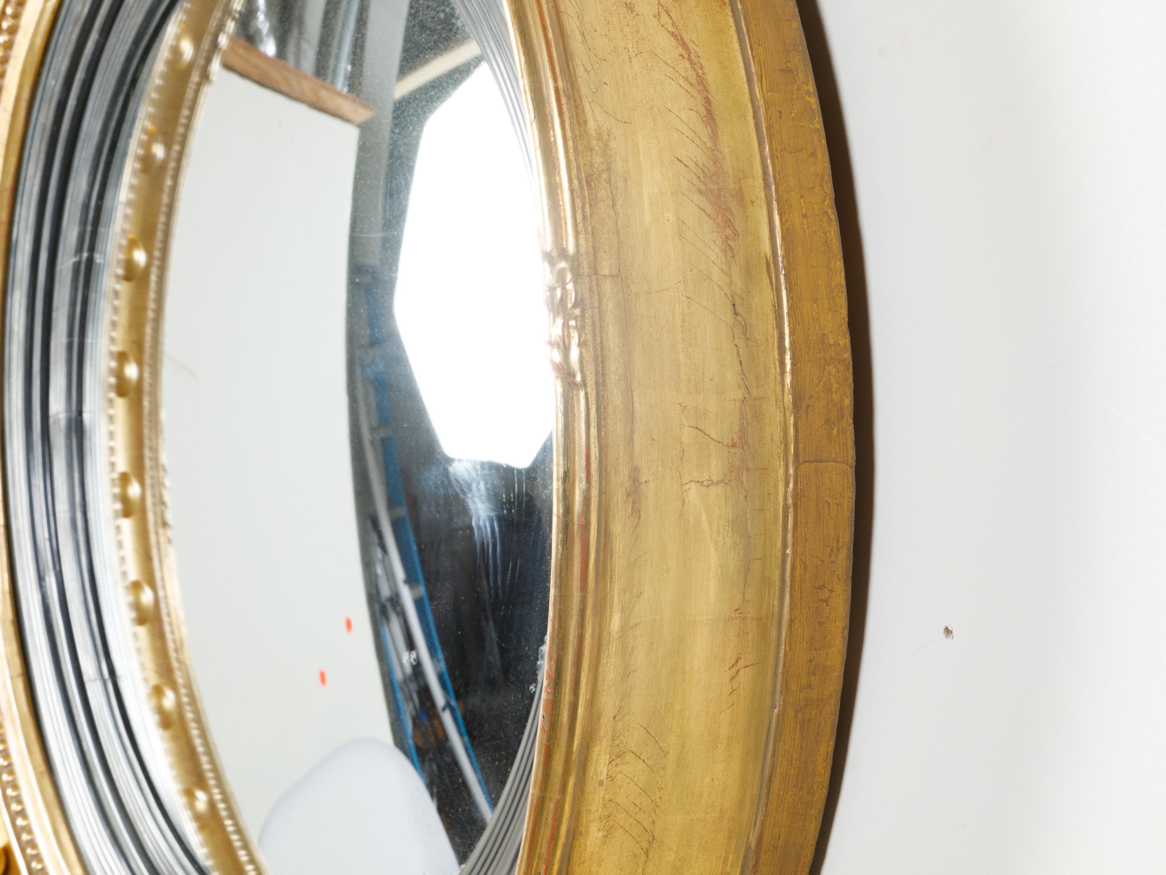 English 19th Century Giltwood Convex Girandole Bullseye Mirror with Eagle Motif In Good Condition For Sale In Atlanta, GA