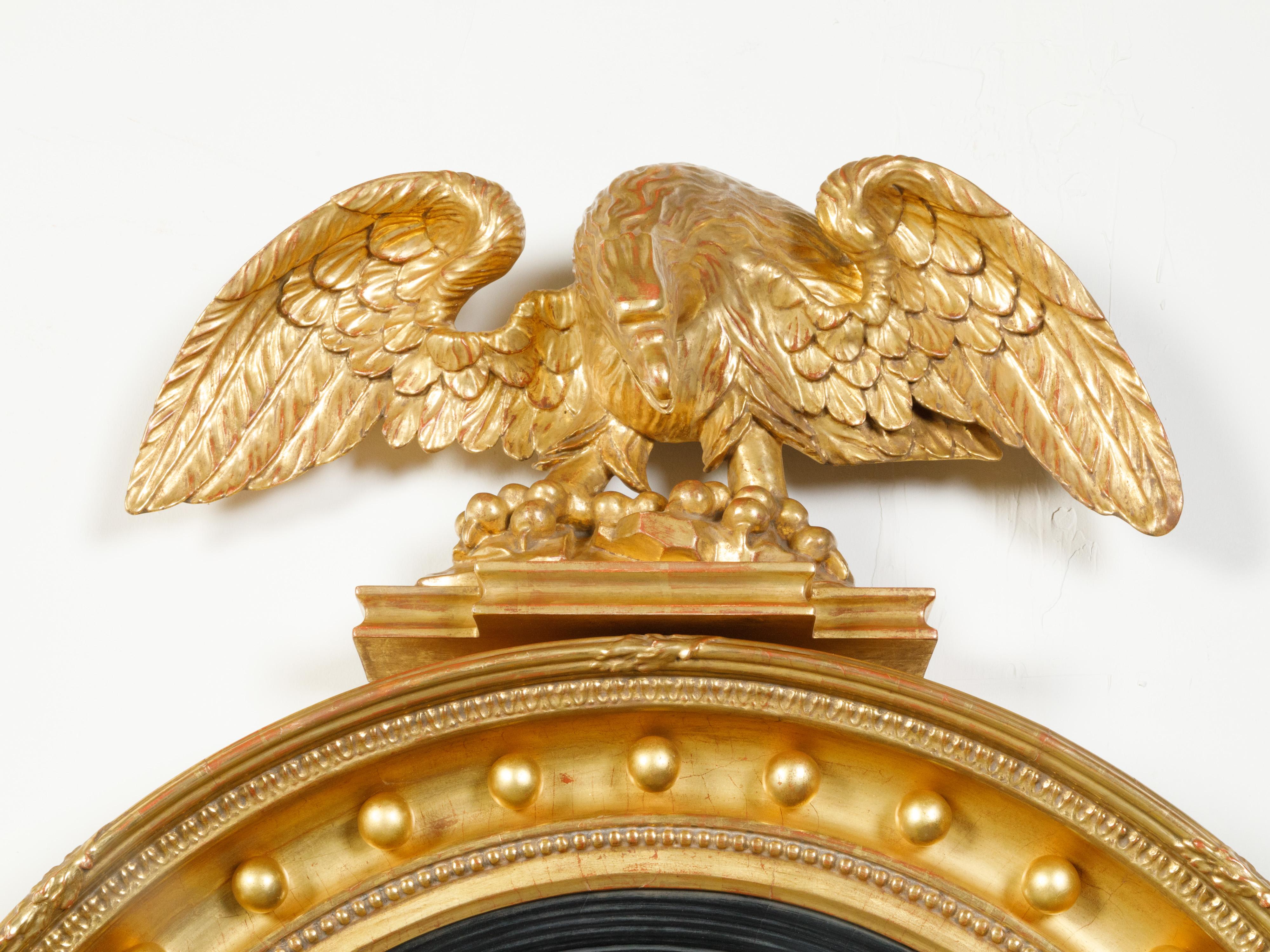 English 19th Century Giltwood Convex Girandole Bullseye Mirror with Eagle Motif For Sale 1
