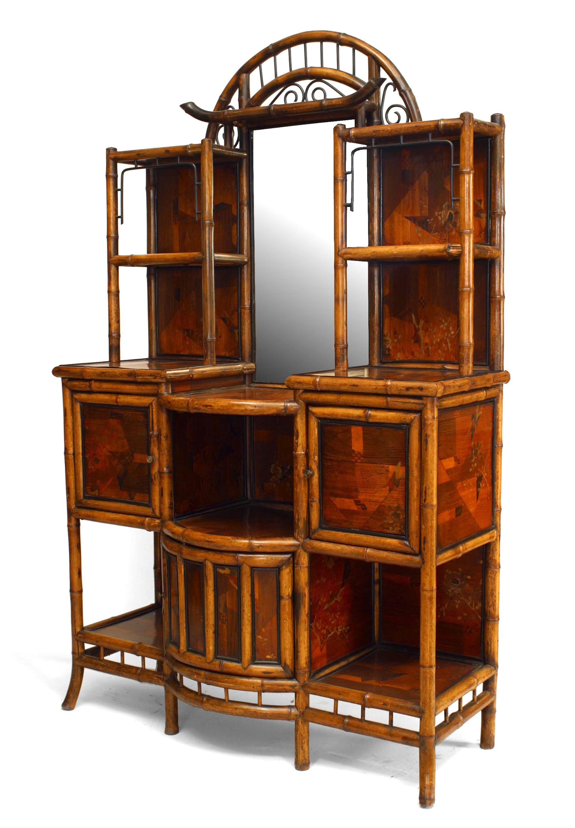English Victorian bamboo and lacquer trimmed inlaid bow front etagere with door and mirrored back.
