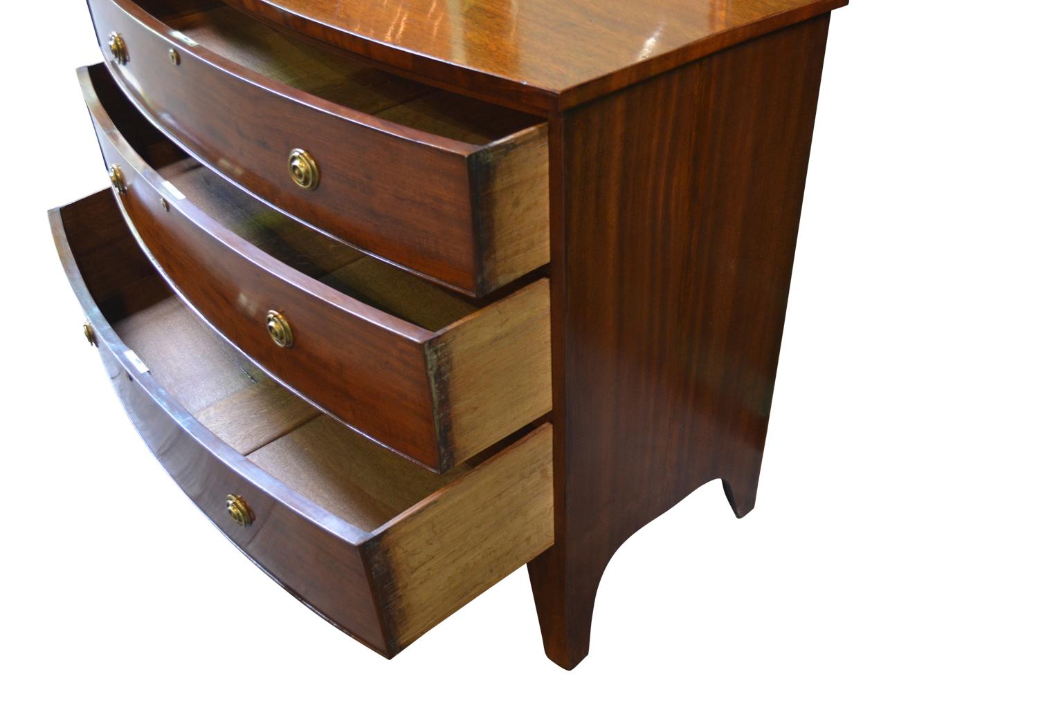 English 19th century George IV mahogany bow fronted chest of drawers terminated on splayed feet, circa 1830.