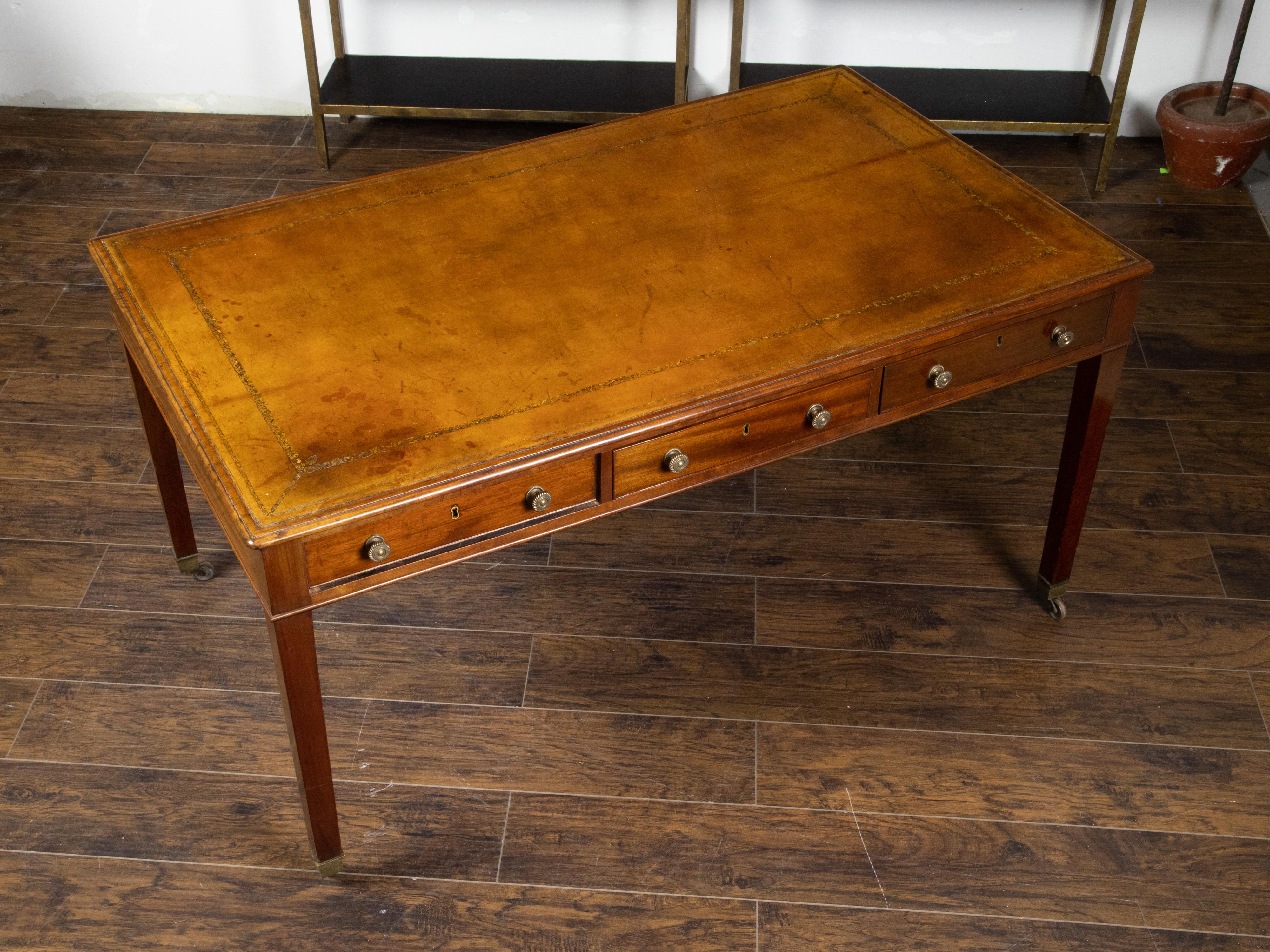 English 19th Century Mahogany Desk with Three Drawers, Mounted on Brass Casters 8
