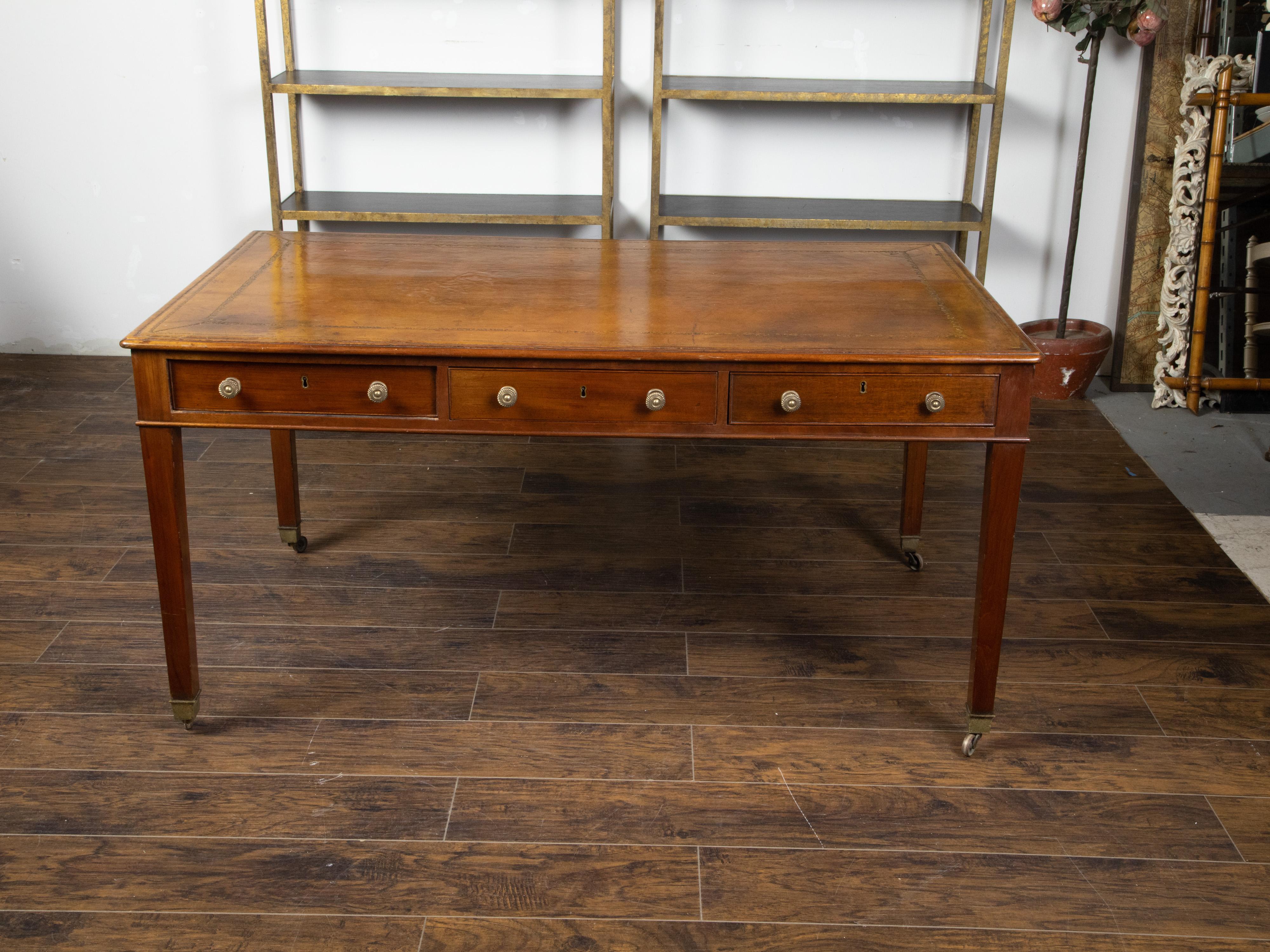 English 19th Century Mahogany Desk with Three Drawers, Mounted on Brass Casters 3