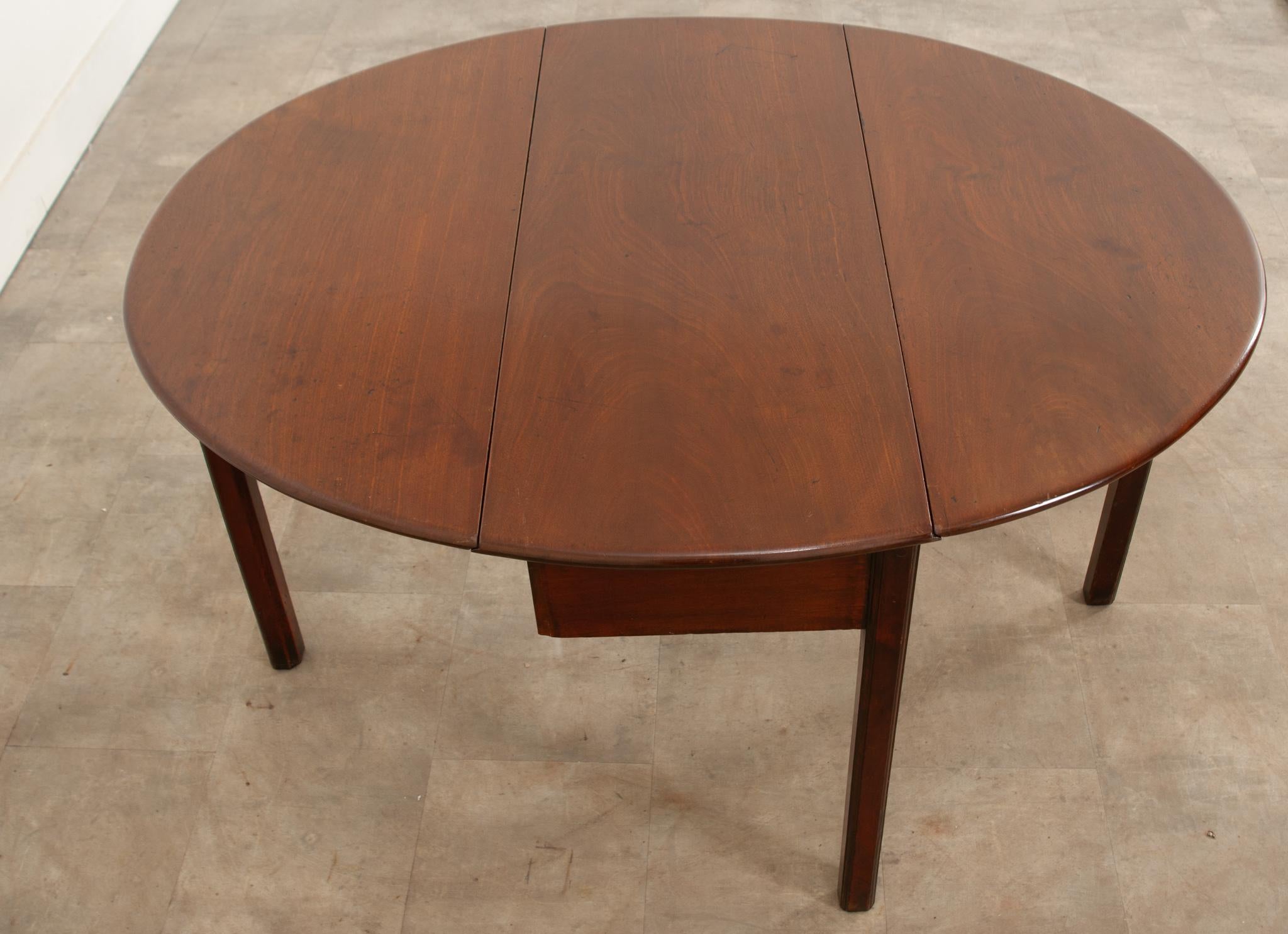 Patinated English 19th Century Mahogany Drop Leaf Table For Sale