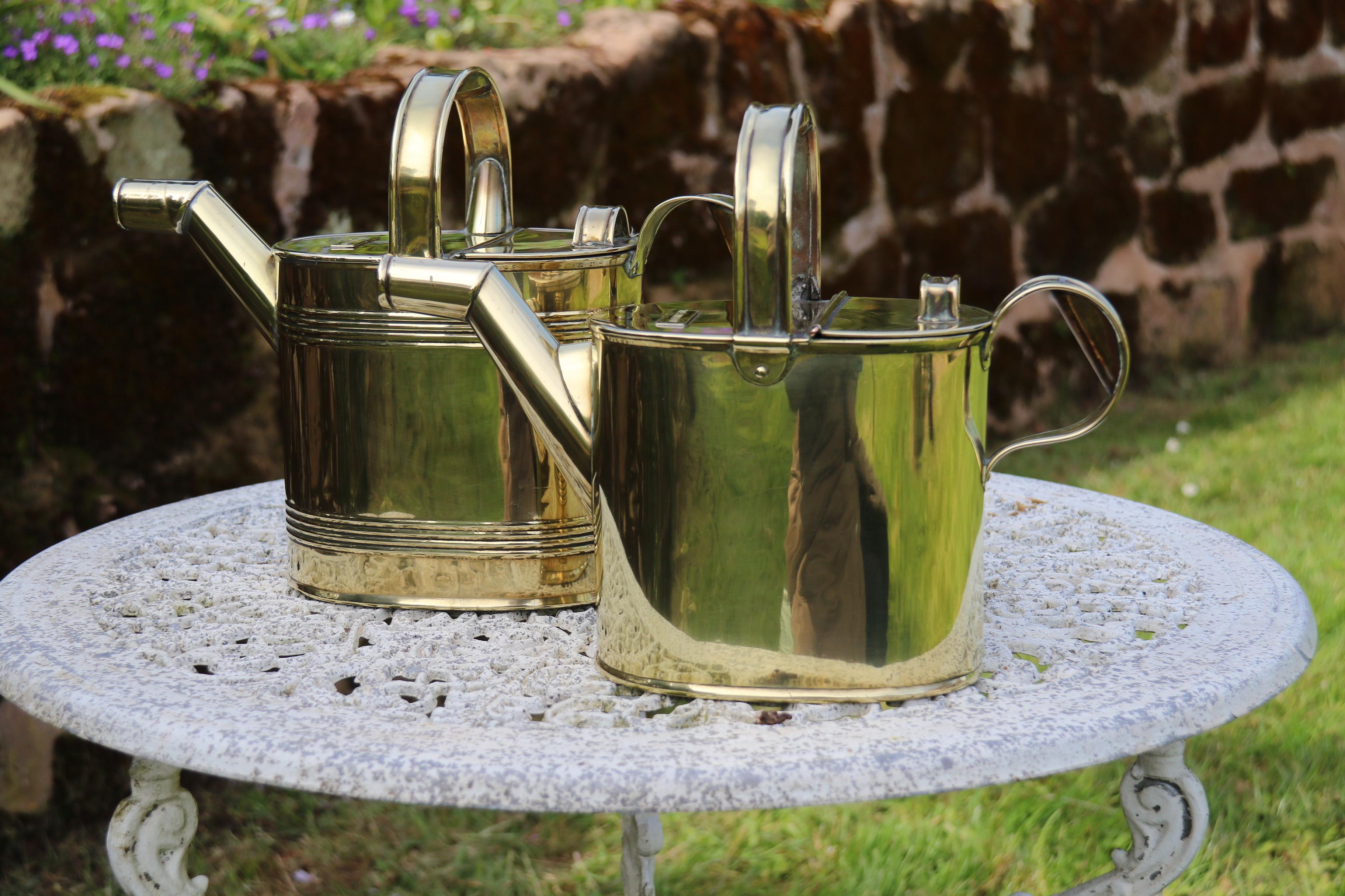 Edwardian English 19th century matched pair of brass watering cans from a London Hotel For Sale