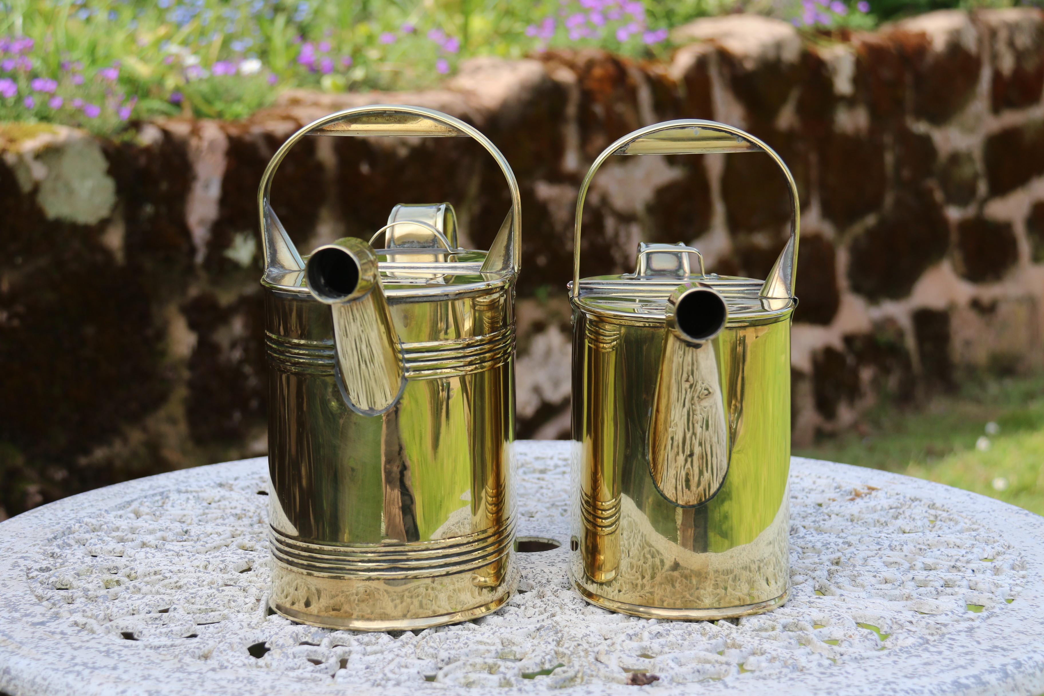 Hand-Crafted English 19th century matched pair of brass watering cans from a London Hotel For Sale