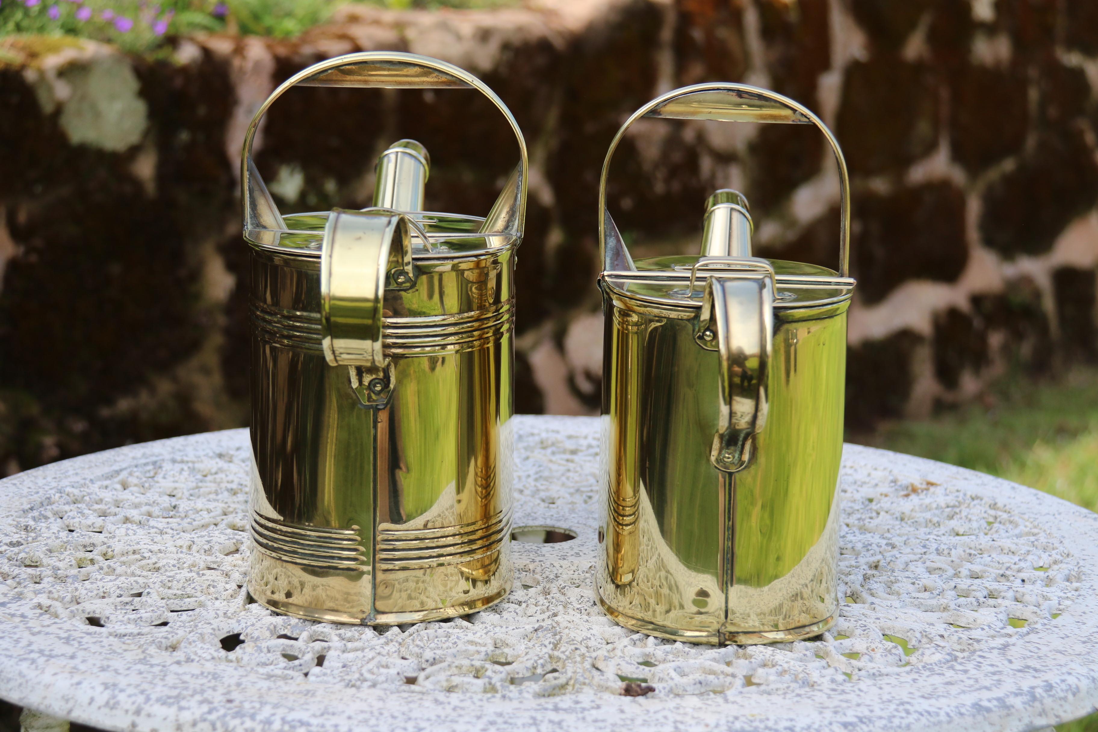Early 20th Century English 19th century matched pair of brass watering cans from a London Hotel For Sale