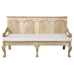 Used English 19th Century Oak Bench with Carved Back, Downswept Arms and Cushion