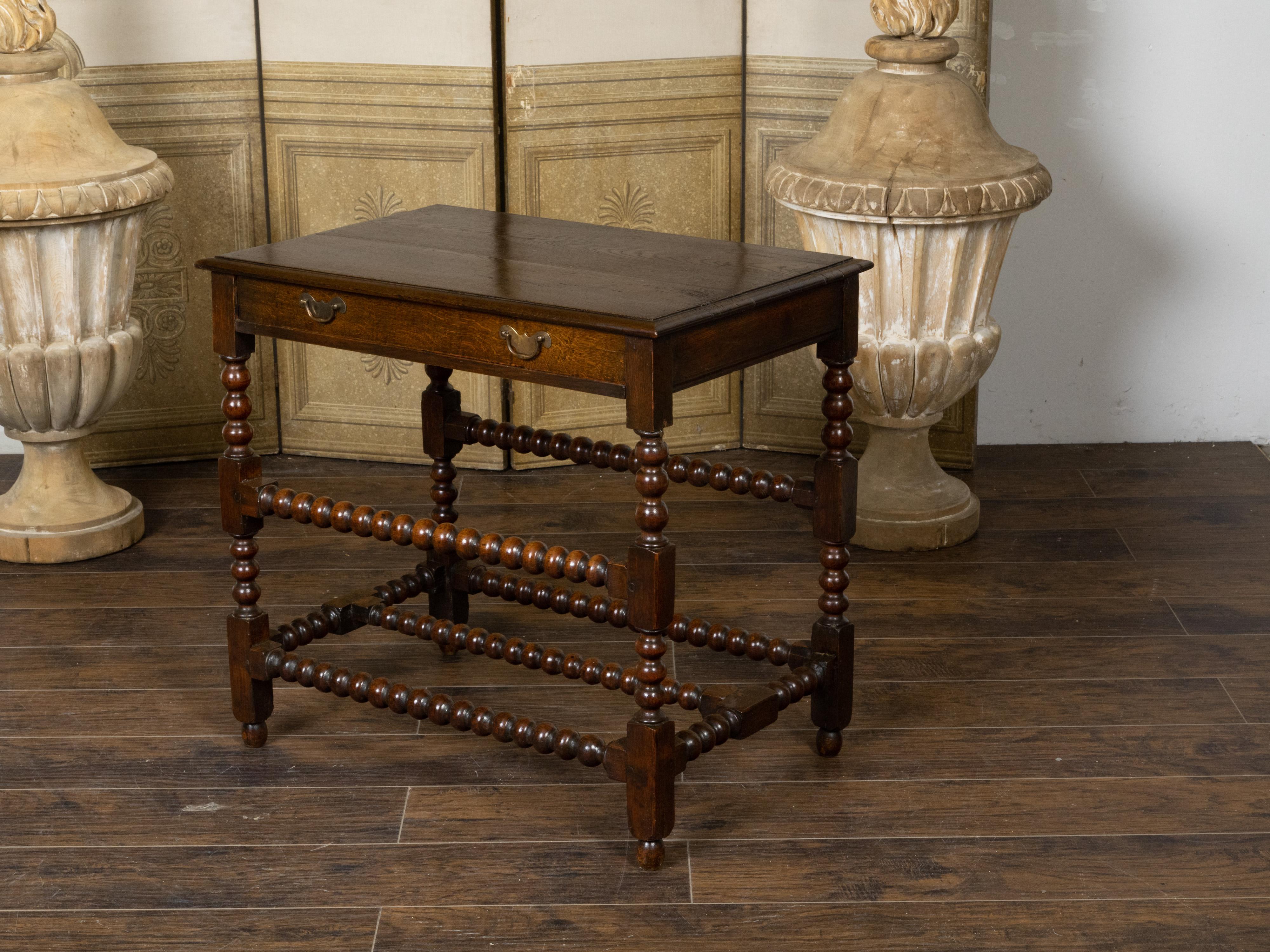 Brass English 19th Century Oak Bobbin Leg Table with Single Drawer and Cross Stretcher For Sale