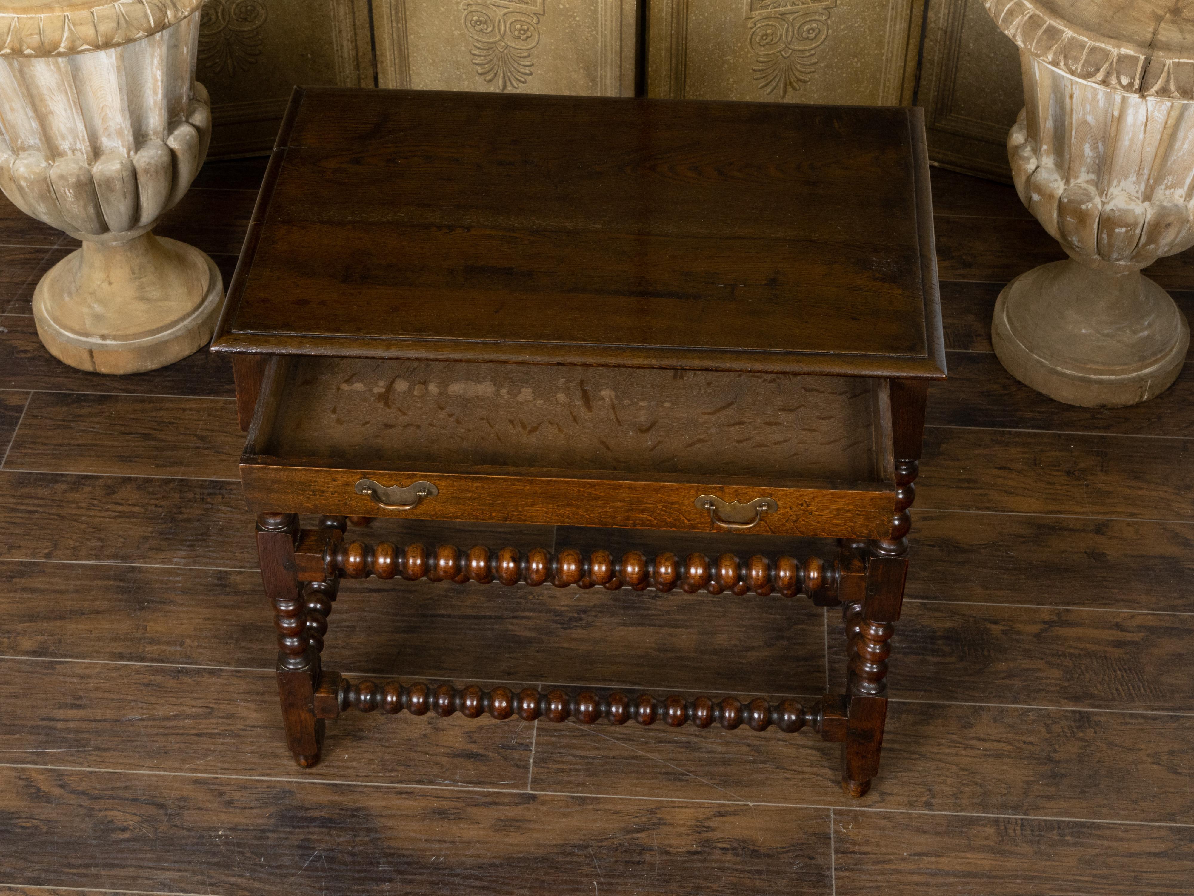 Brass English 19th Century Oak Bobbin Leg Table with Single Drawer and Cross Stretcher For Sale
