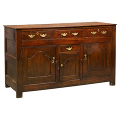 English 19th Century Oak Buffet with Four Drawers and Three Doors