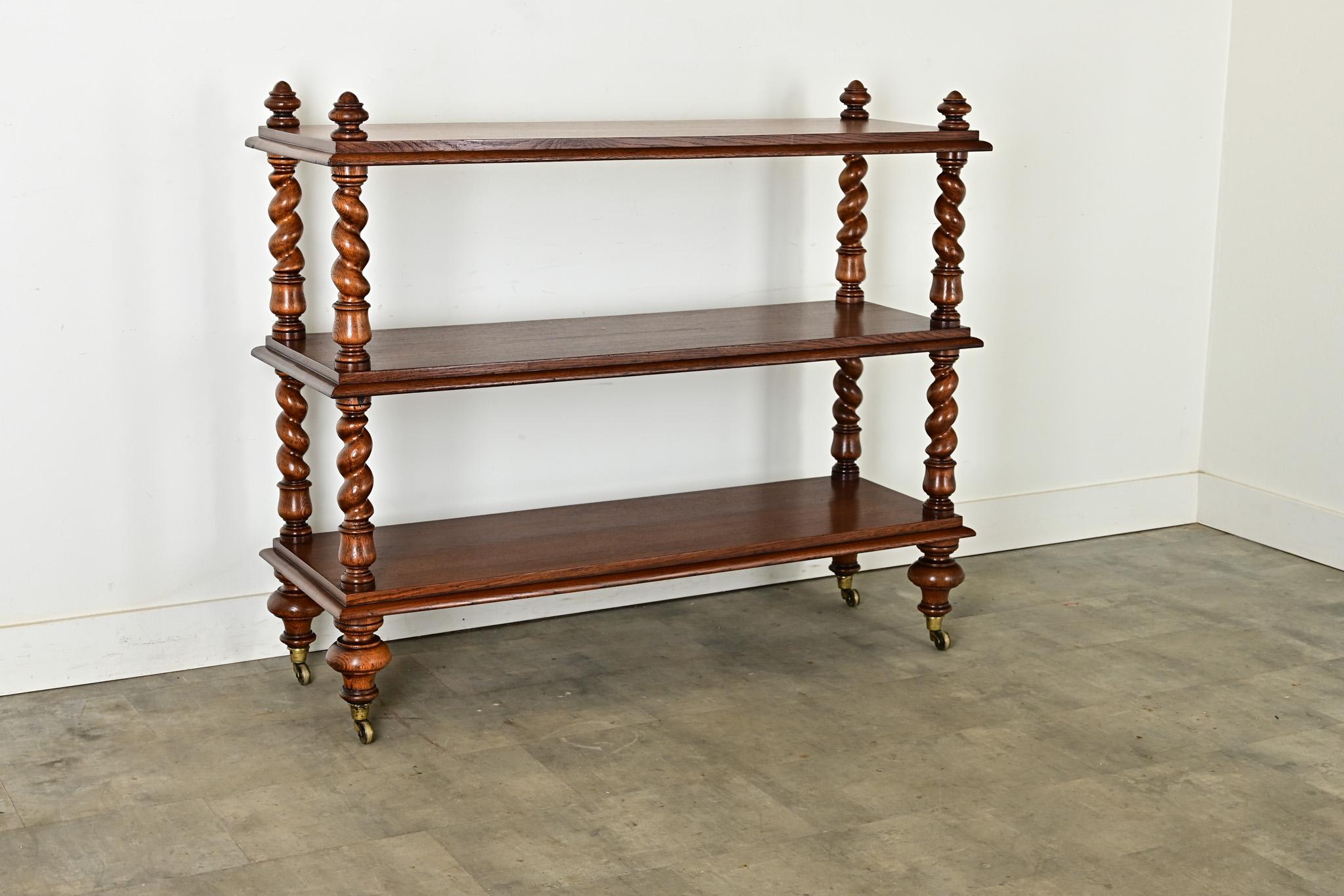 A gorgeous serving trolley, made of richly figured oak planks and barley-twist posts from 19th century England, circa 1840s. This beautiful antique has a wonderfully patinated and inviting finish that looks distinguished for use in nearly any room