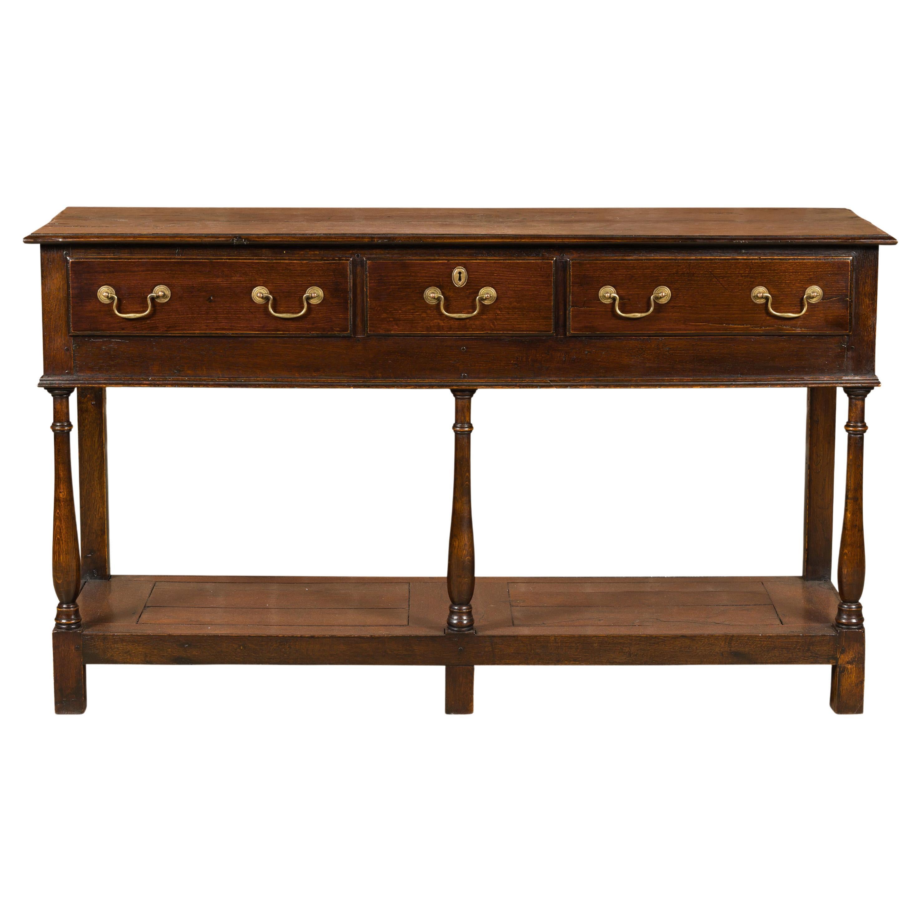 English 19th Century Oak Dresser Base with Three Drawers and Baluster Legs For Sale