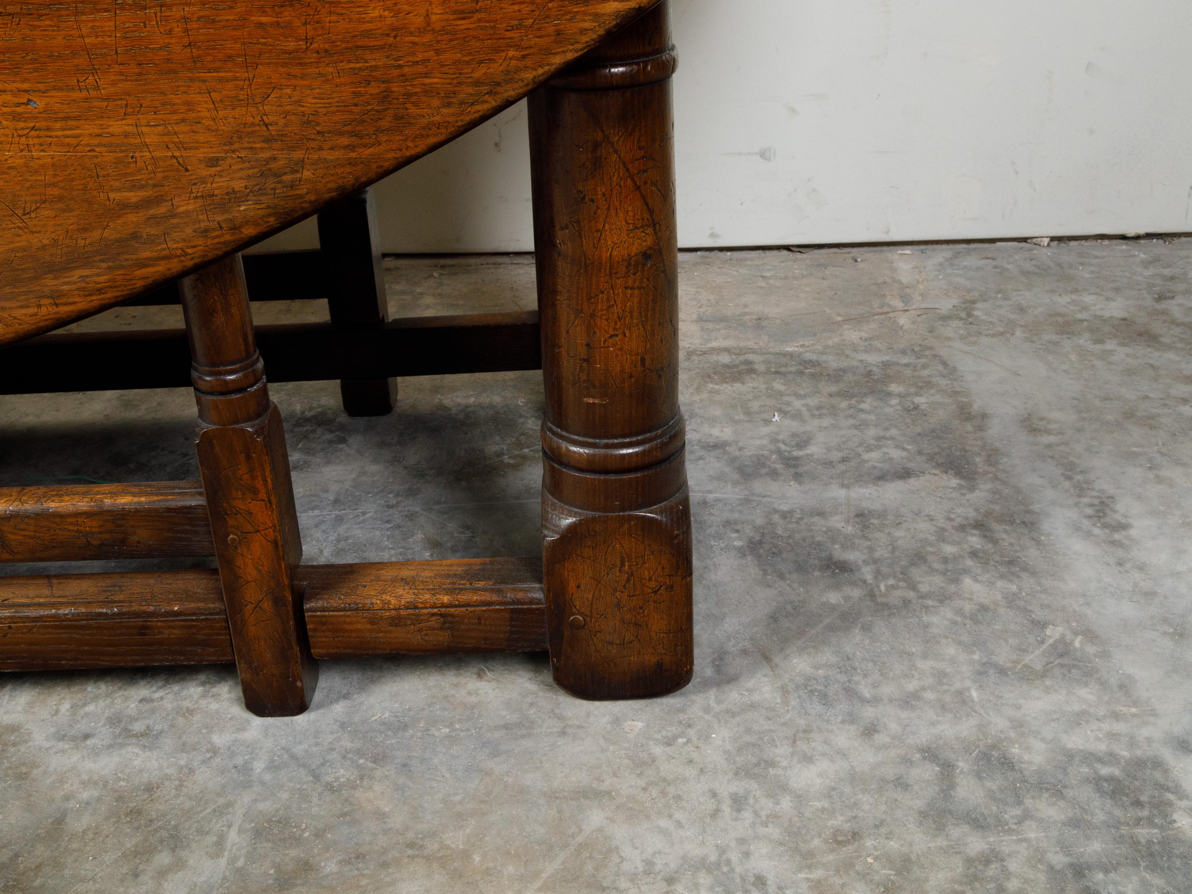English 19th Century Oak Drop-Leaf Oval Top Table with Gateleg Base 6