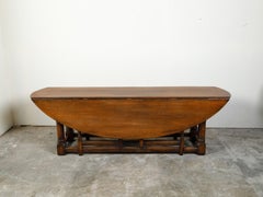 English 19th Century Oak Drop-Leaf Oval Top Table with Gateleg Base