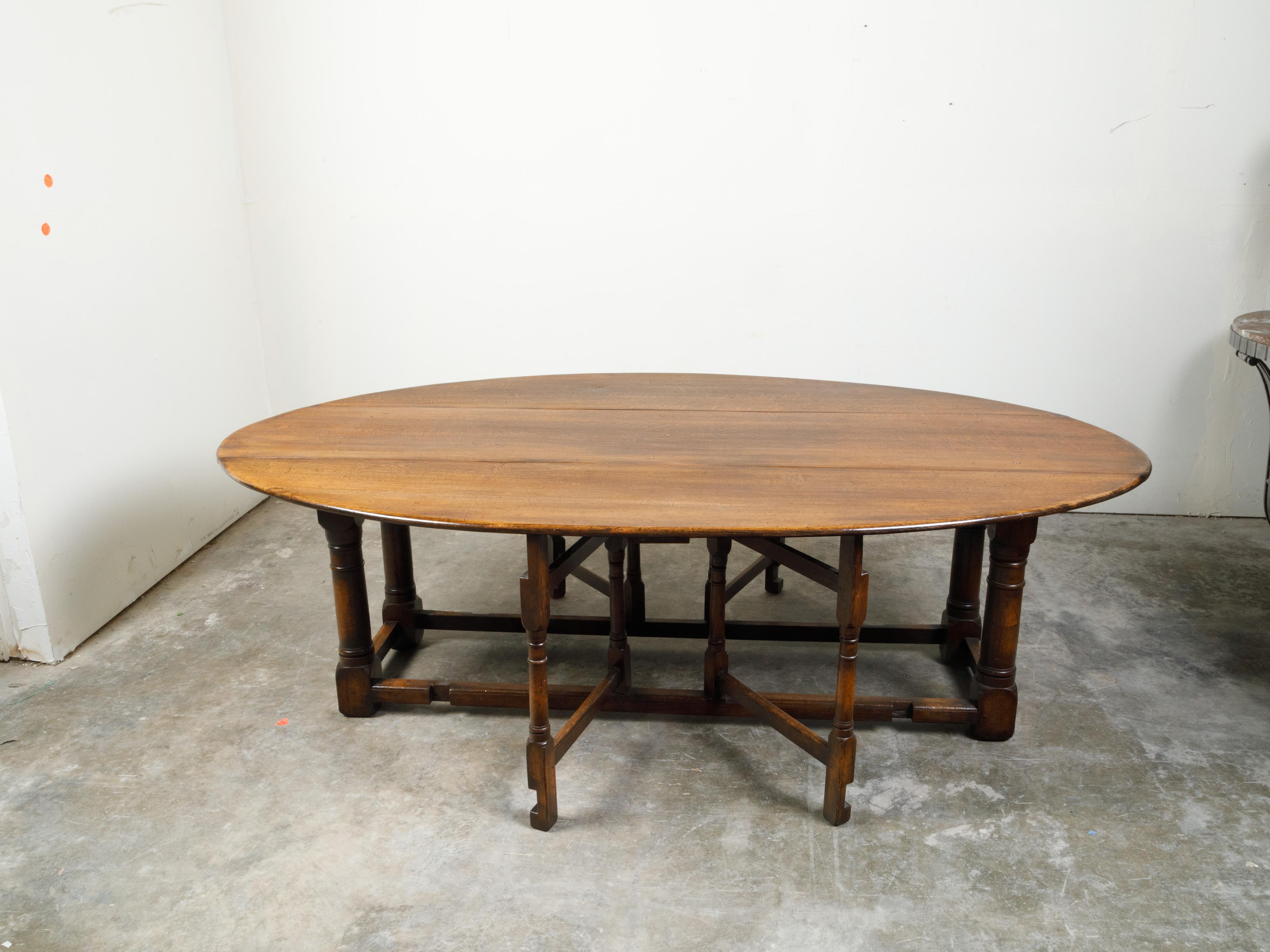 English 19th Century Oak Drop-Leaf Oval Top Table with Gateleg Base 2