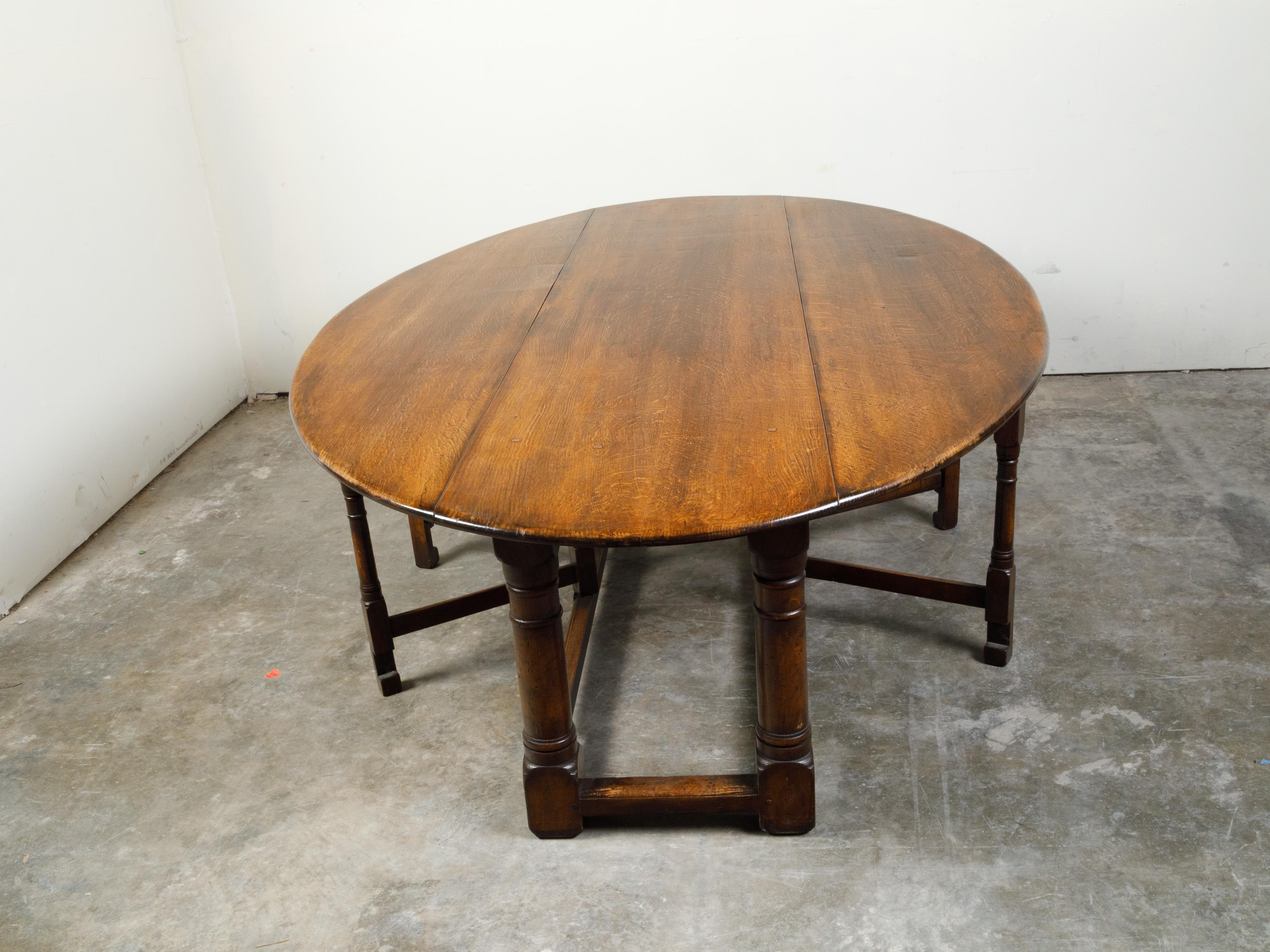 English 19th Century Oak Drop-Leaf Oval Top Table with Gateleg Base 3