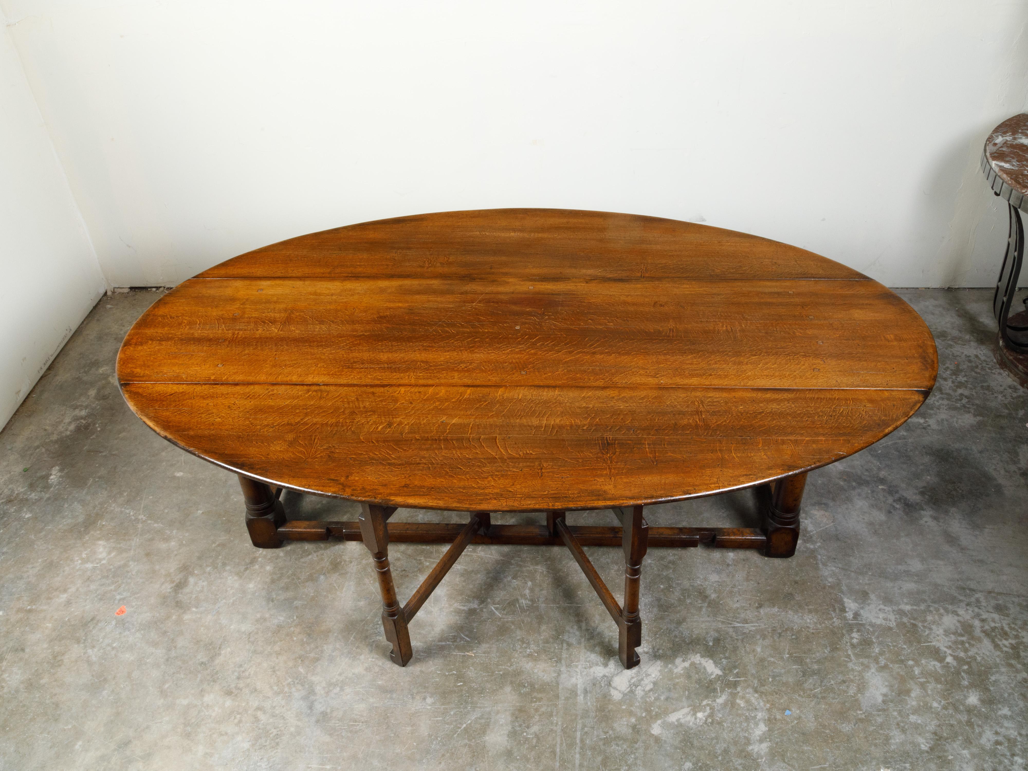 English 19th Century Oak Drop-Leaf Oval Top Table with Gateleg Base 5