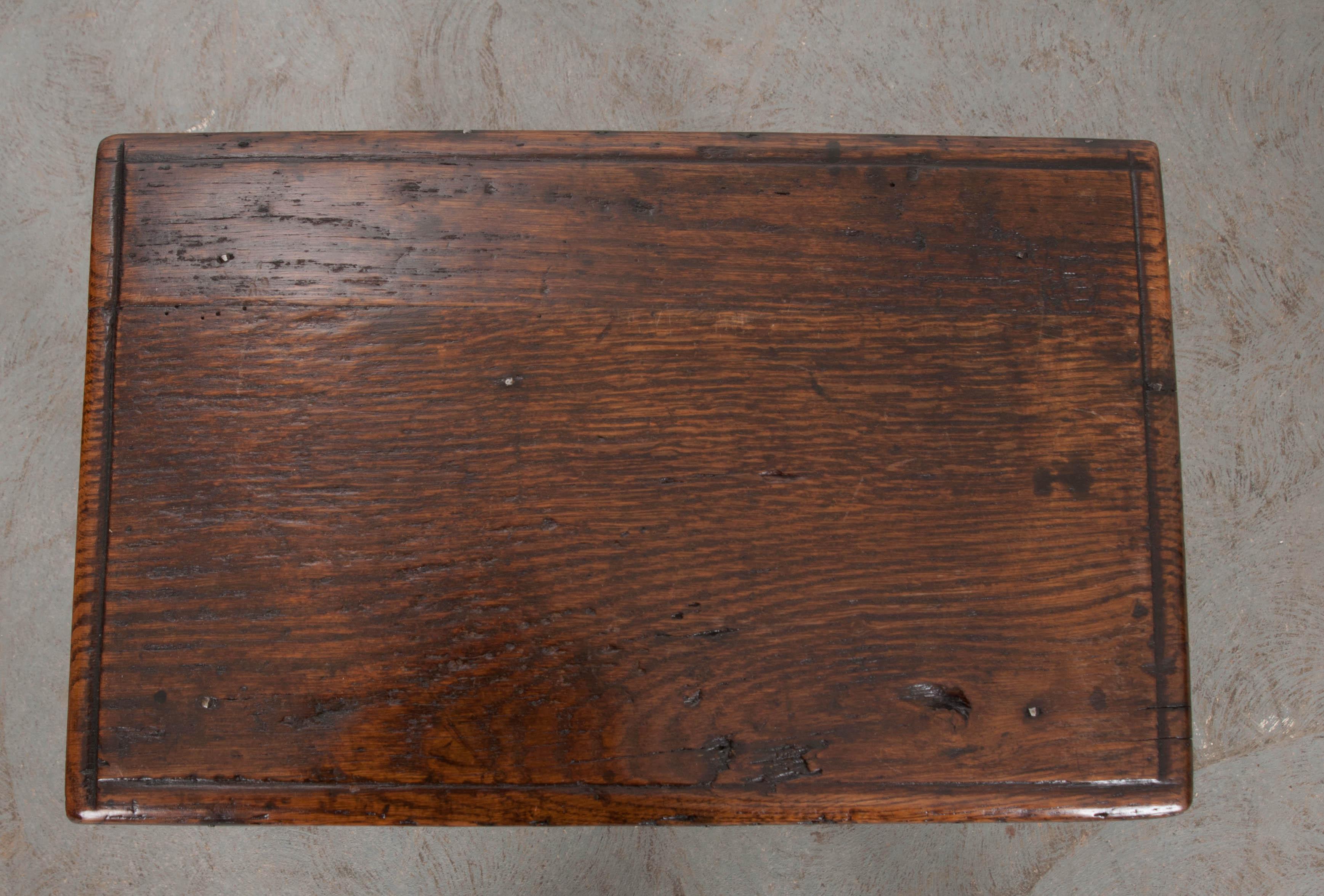 A darling carved and turned English oak stool with all hand-pegged joints, 1880.