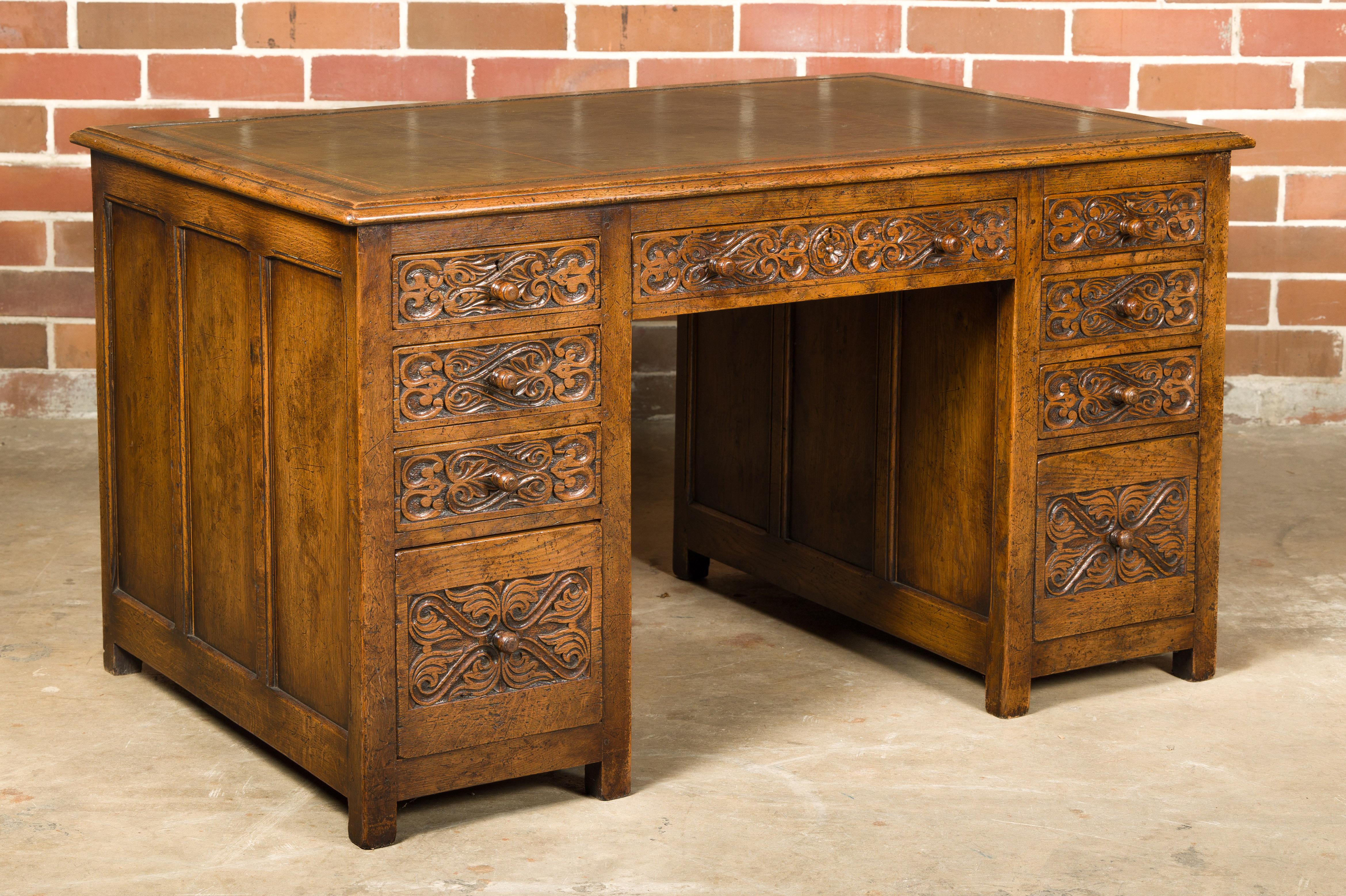 English 19th Century Oak Kneehole Desk with Nine Drawers and Carved Foliage For Sale 10