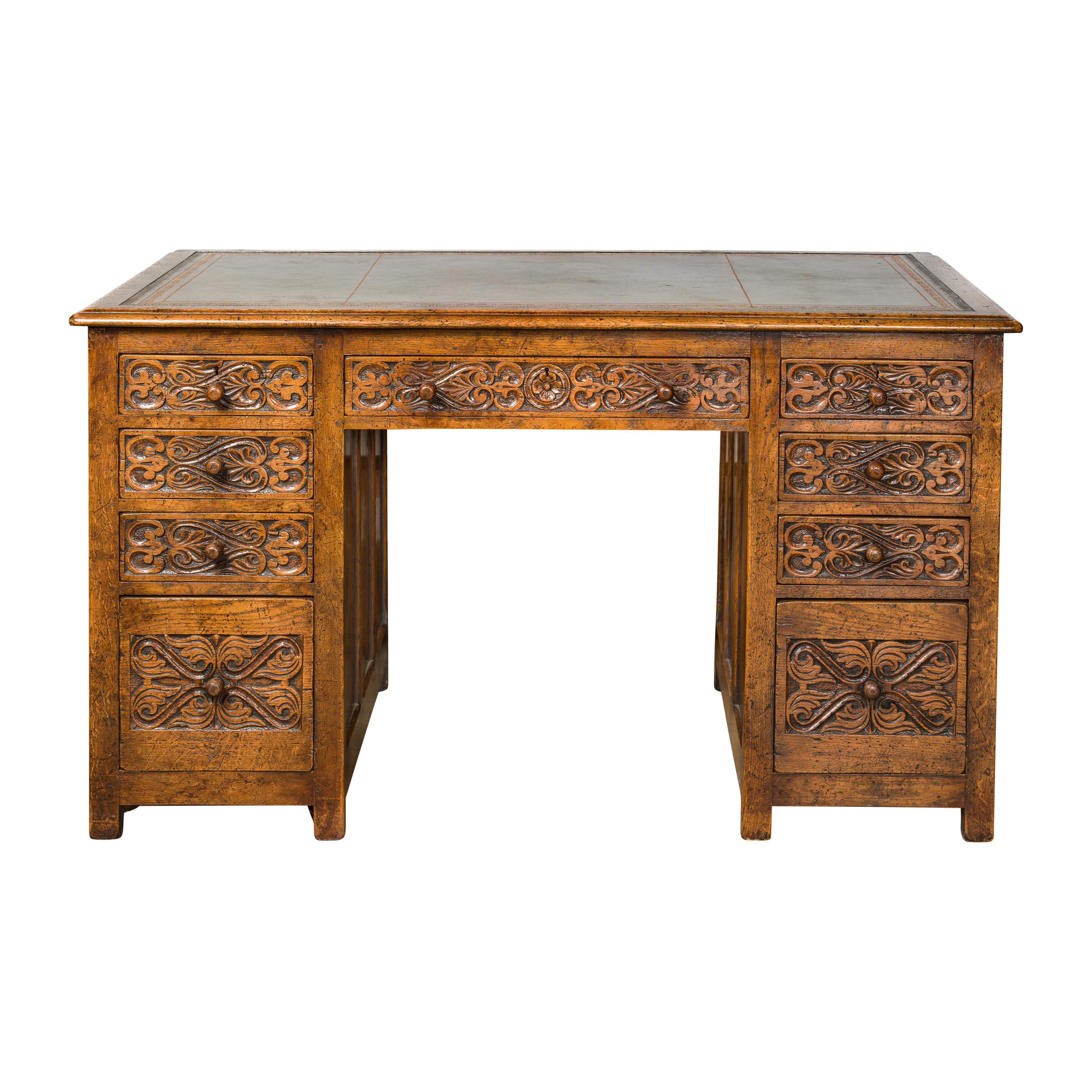 English 19th Century Oak Kneehole Desk with Nine Drawers and Carved Foliage For Sale 15