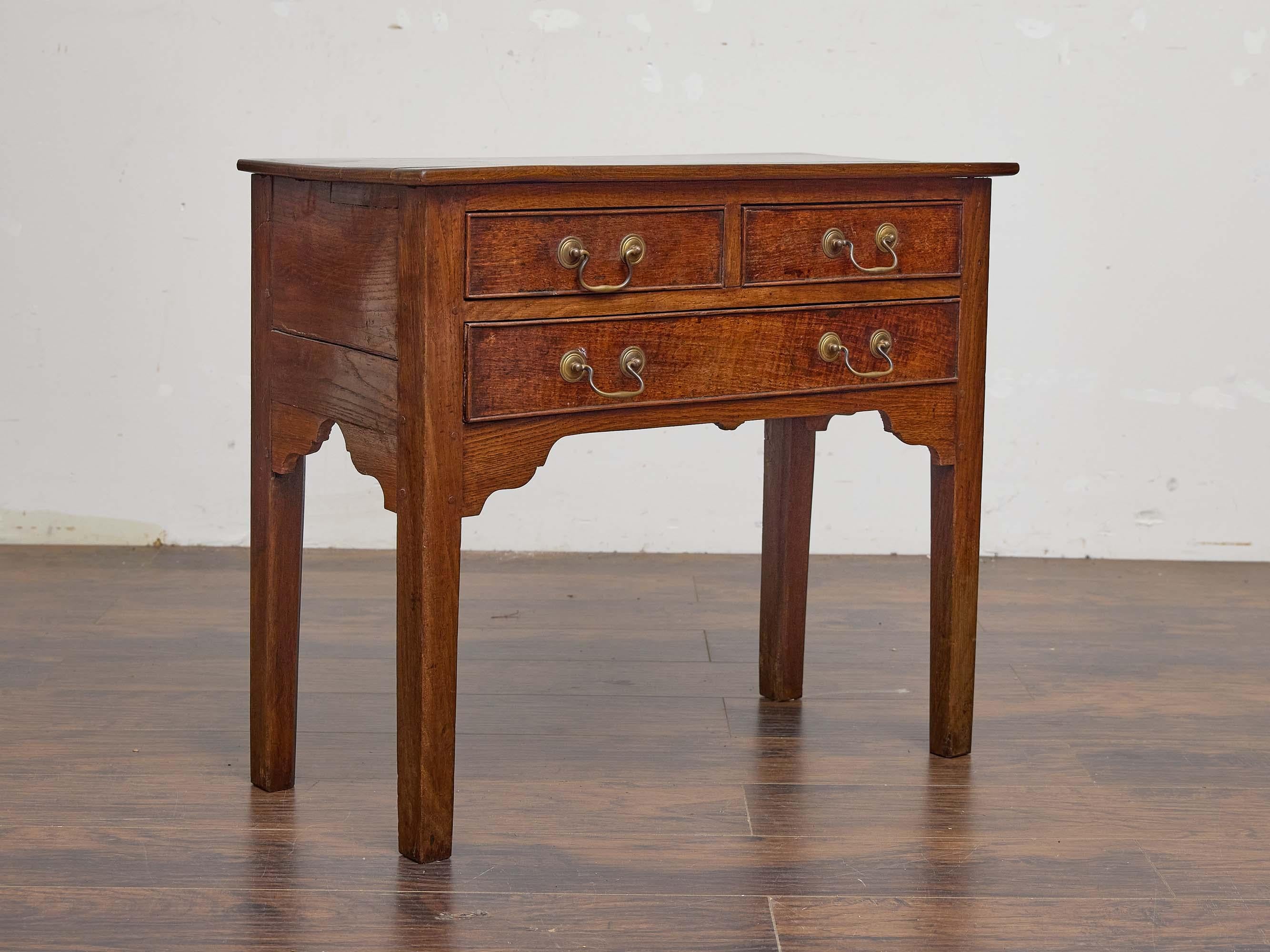 Carved English 19th Century Oak Lowboy with Brass Drop Handles For Sale