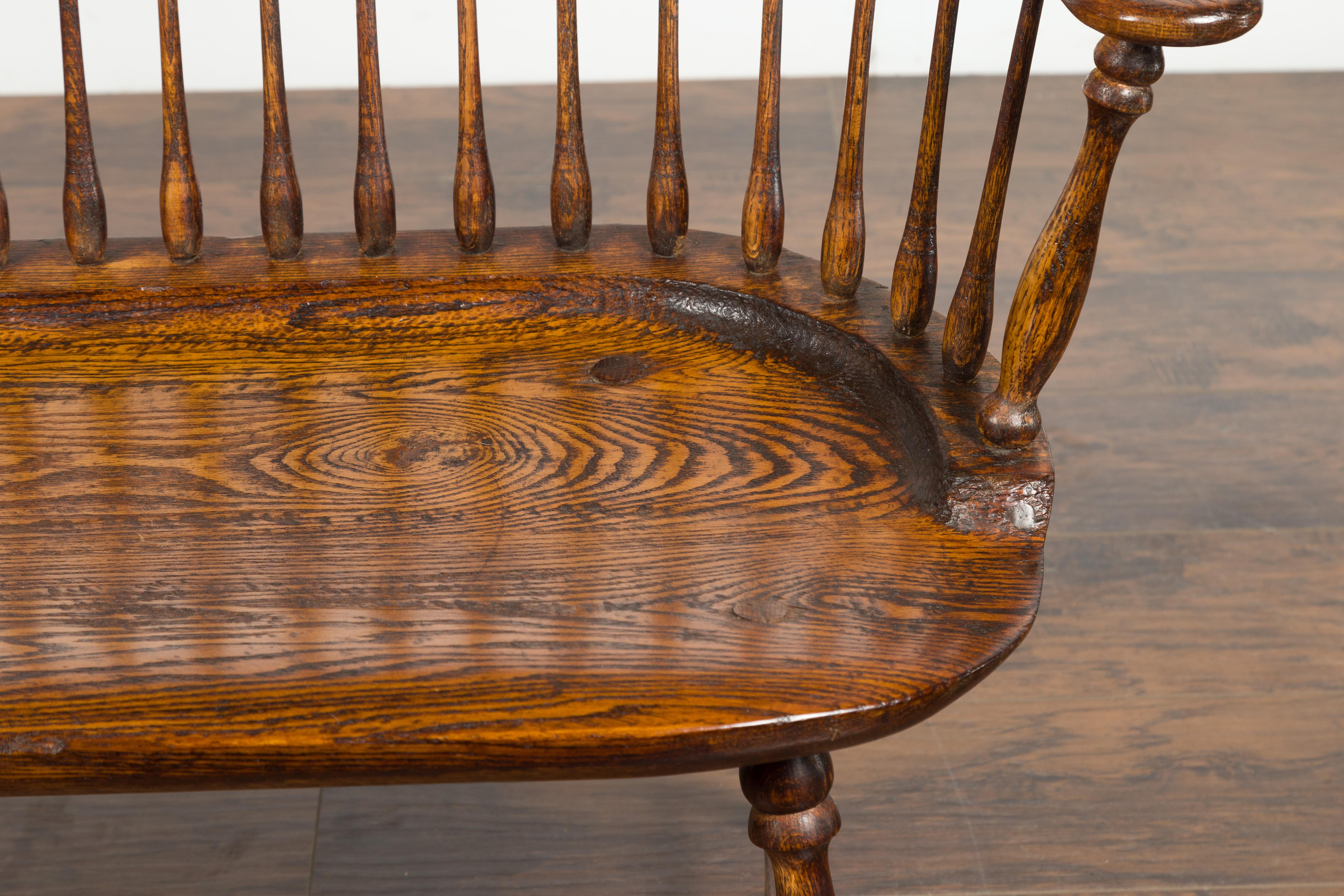 English 19th Century Oak Windsor Bench with Spindle Accents and Cross Stretcher 7