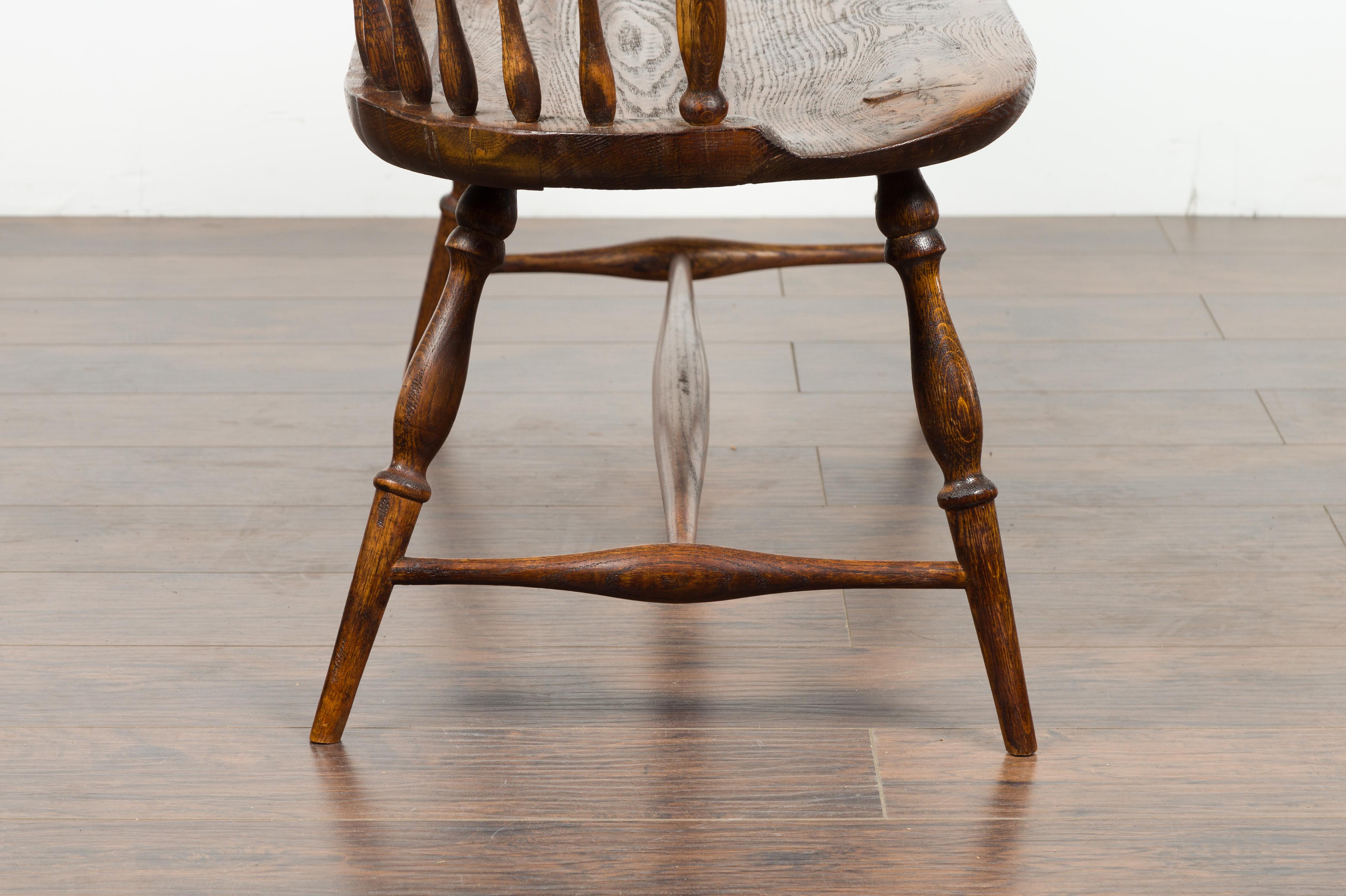 English 19th Century Oak Windsor Bench with Spindle Accents and Cross Stretcher 11