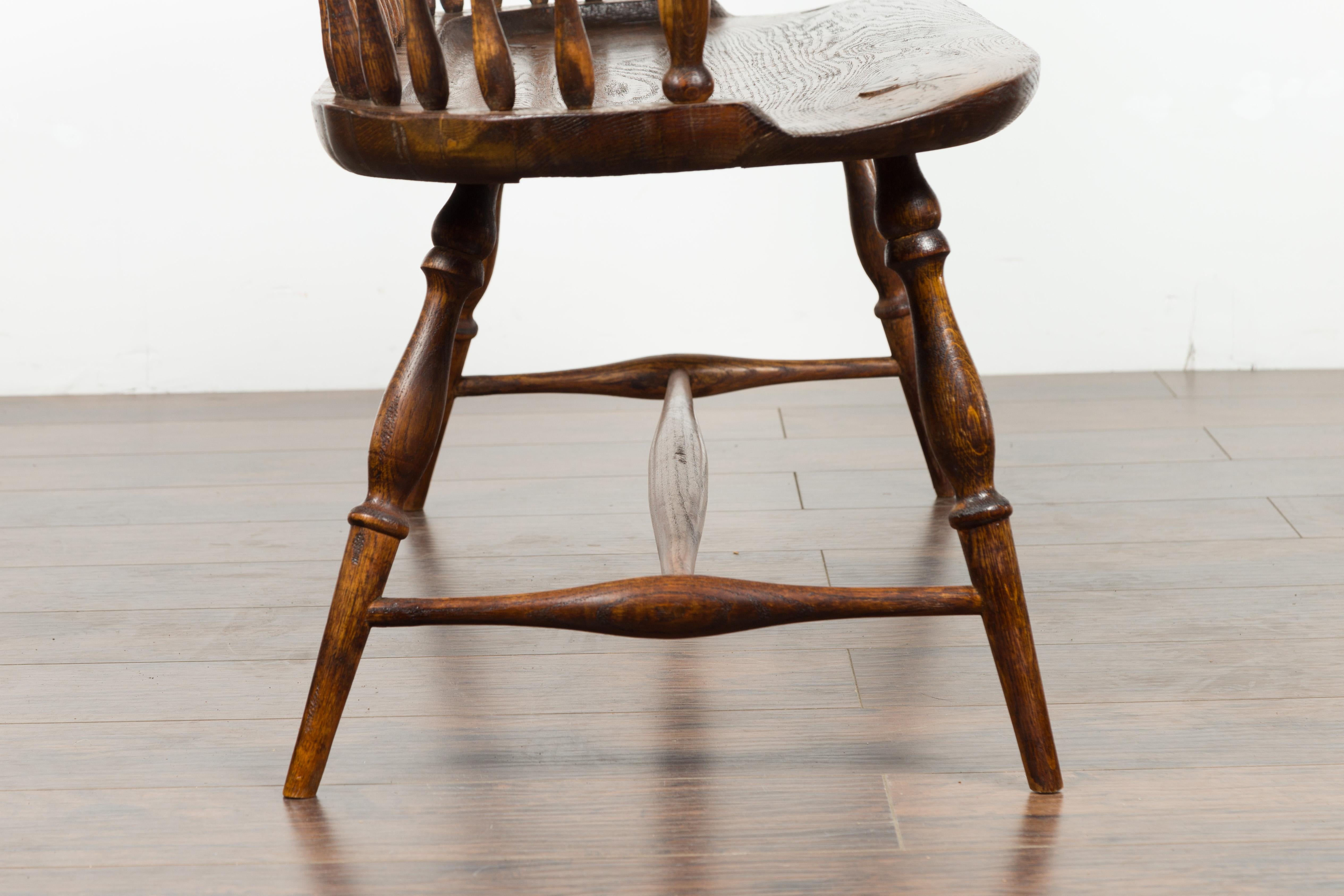 English 19th Century Oak Windsor Bench with Spindle Accents and Cross Stretcher 13