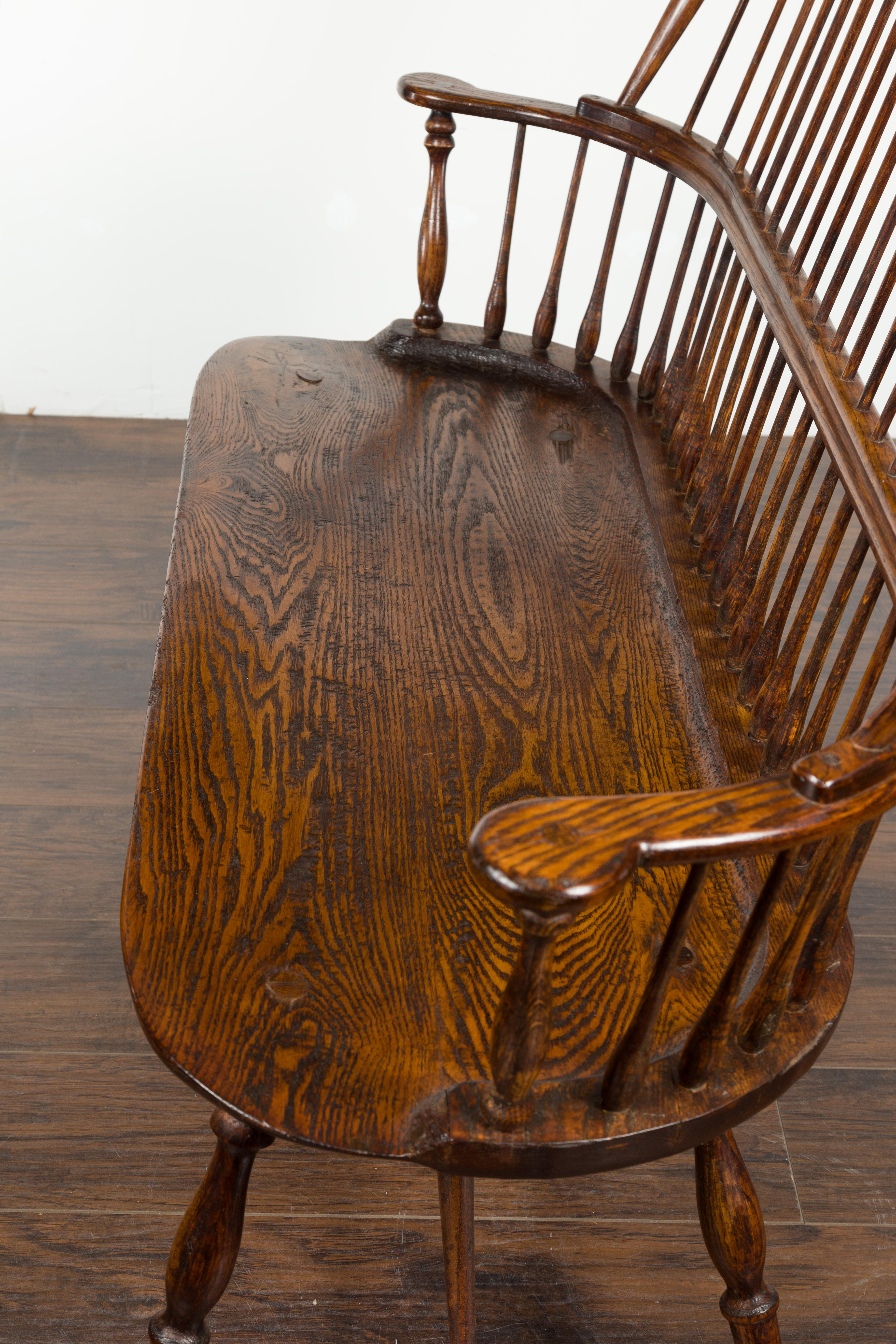 English 19th Century Oak Windsor Bench with Spindle Accents and Cross Stretcher 16