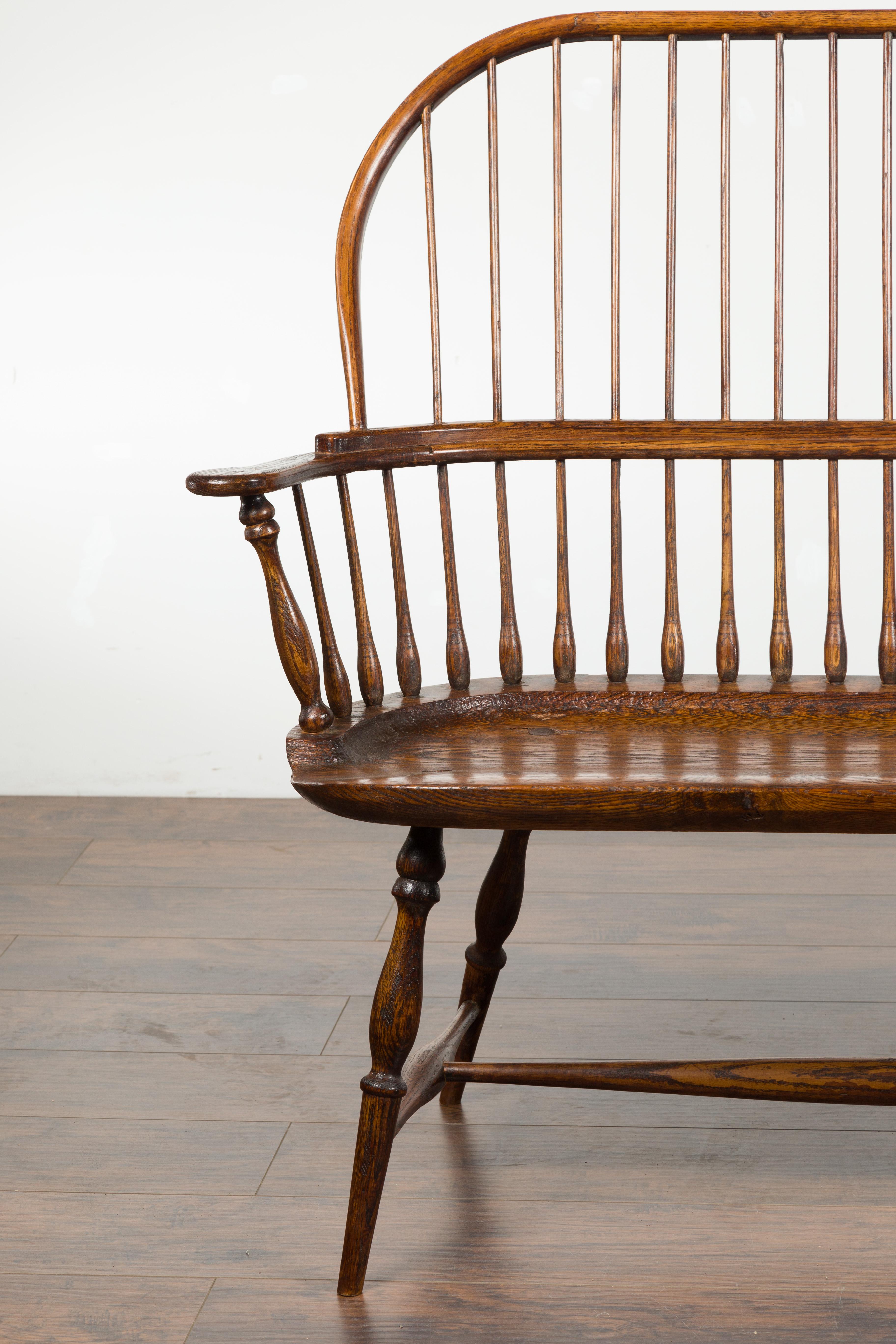 English 19th Century Oak Windsor Bench with Spindle Accents and Cross Stretcher 3