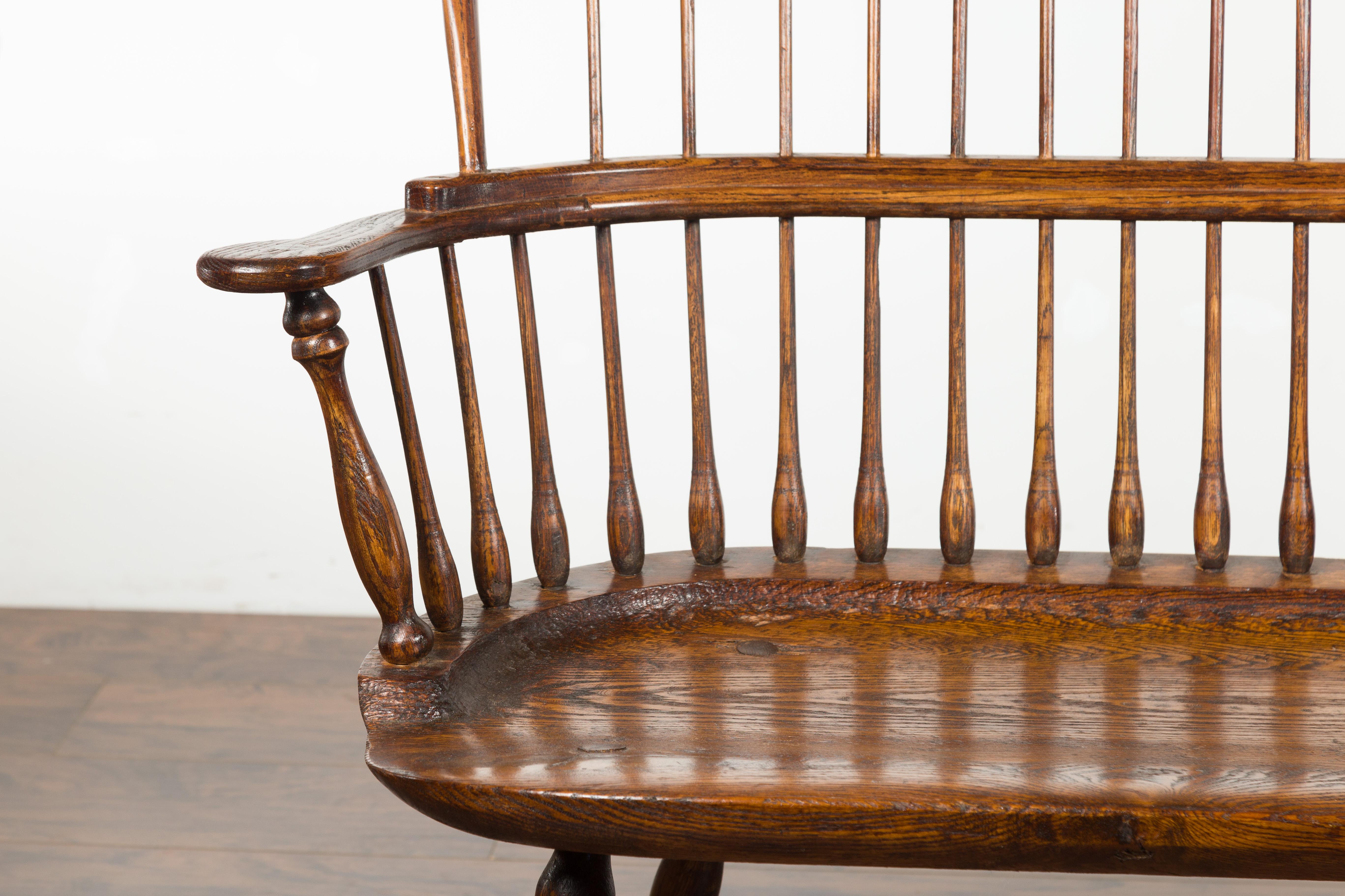 English 19th Century Oak Windsor Bench with Spindle Accents and Cross Stretcher 5