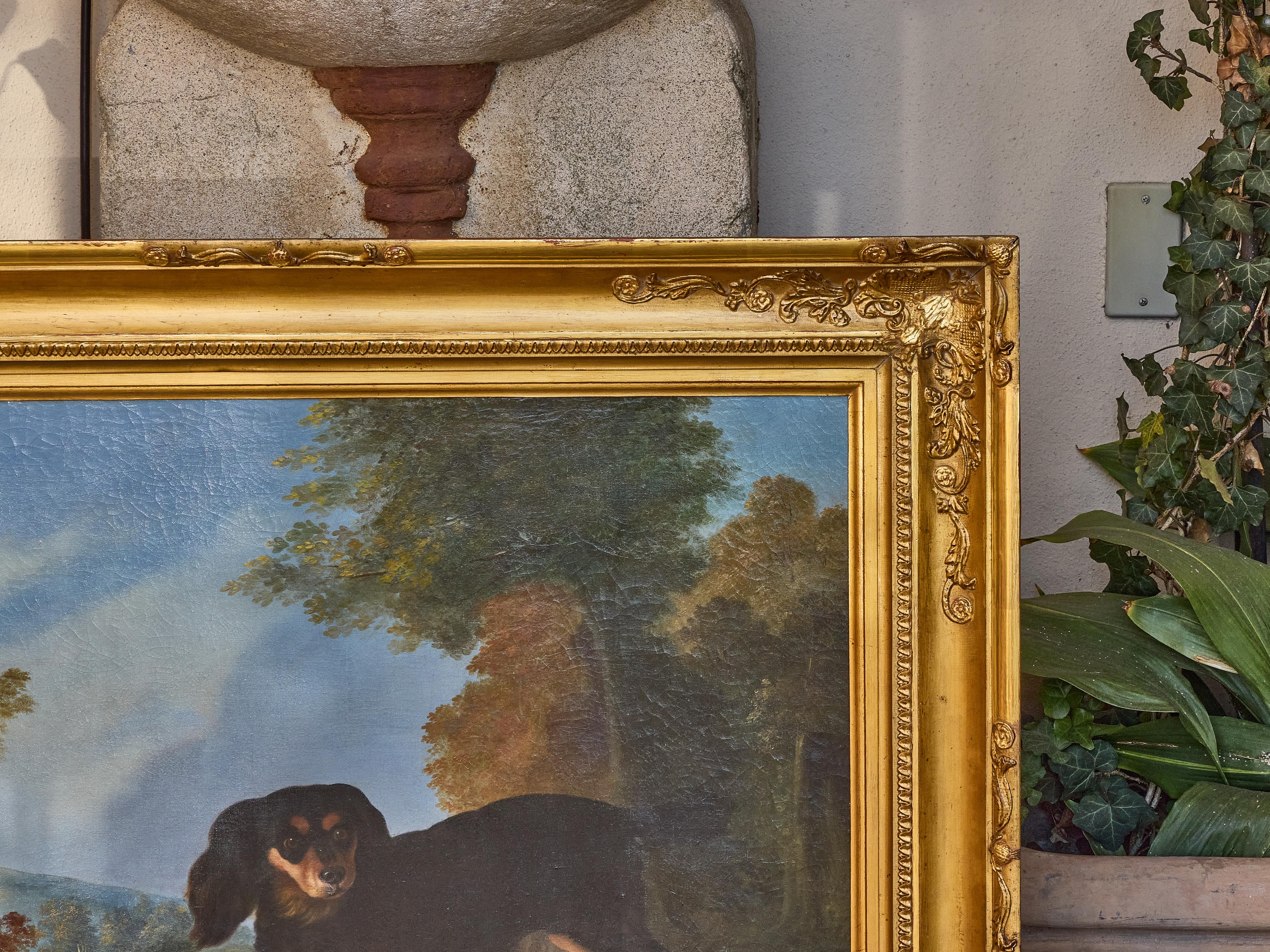An atmospheric English oil on canvas painting from the 19th century, depicting a black-and-tan hunting dog frozen in a moment of stillness, poised and alert as it discovers a pheasant in the underbrush. Its stance is steady, yet full of