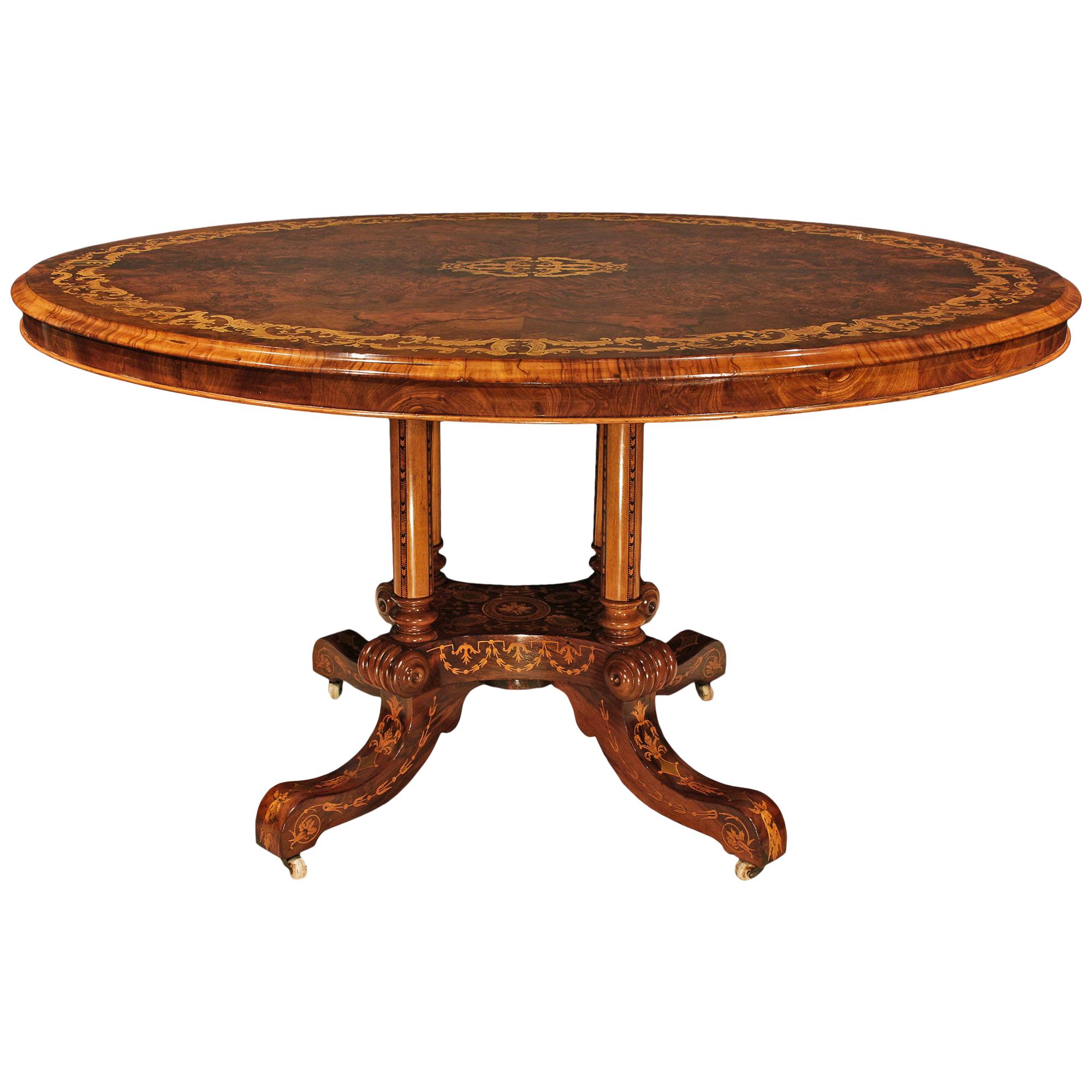 Table centrale ovale anglaise du 19ème siècle à plateau basculant en noyer et bois exotiques en vente
