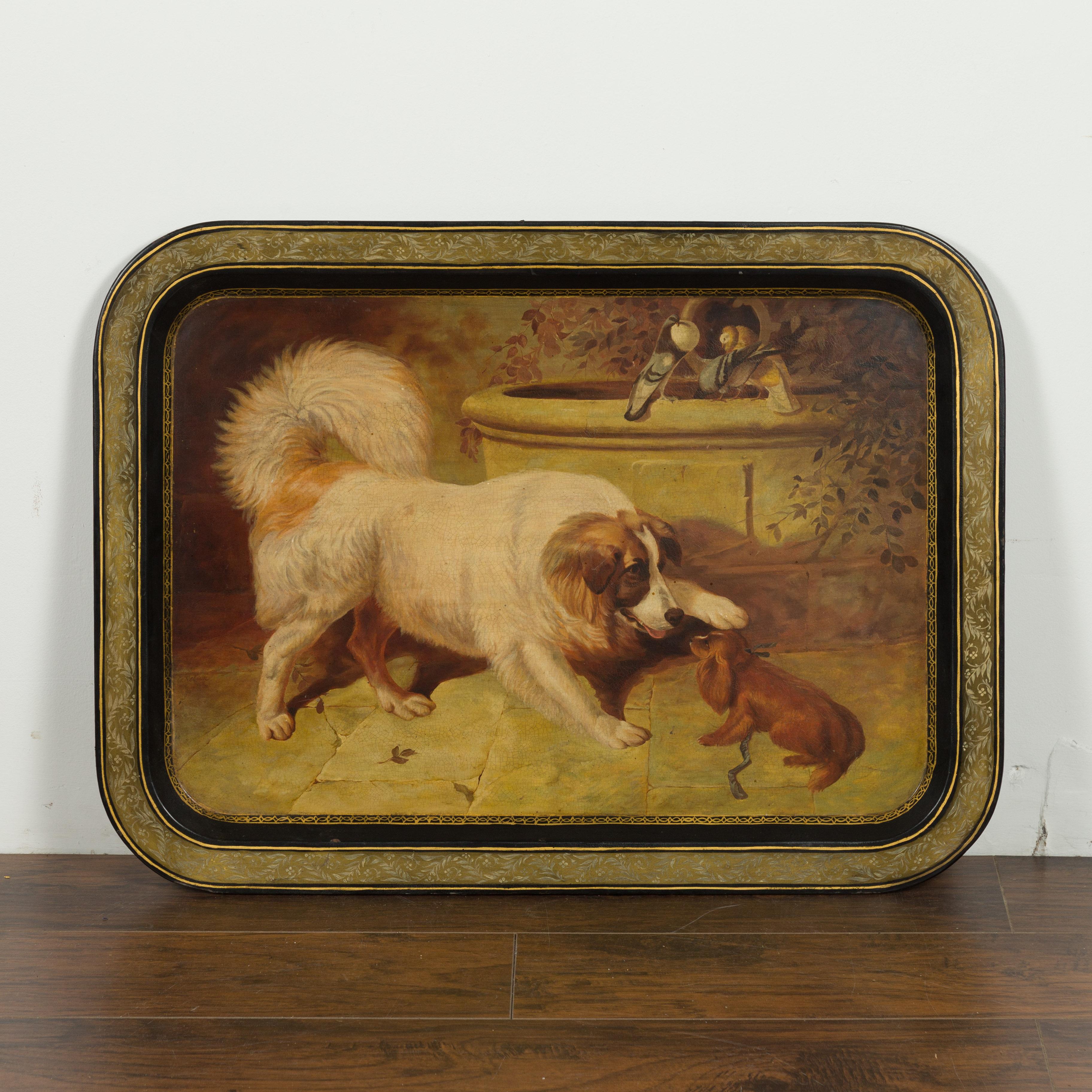 An English painted tôle tray from the 19th century, adorned with dog motifs. Created in England during the 19th century, this tray draws our attention with its skillful depiction of two dogs (a large and a small one) playing with one another in