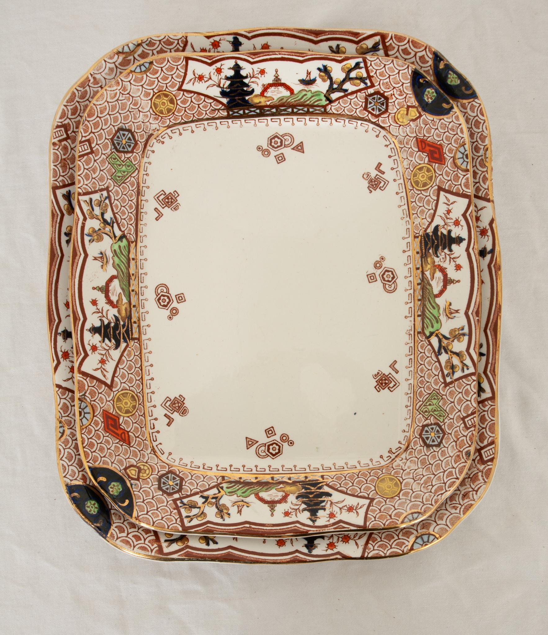 A pair of delightful antique ironstone transferware platters attributed to Mason’s of Staffordshire, England. Mason’s ironstone pottery is renowned for its remarkable blend of durability and design. Decorated in the Aesthetic Movement style with an