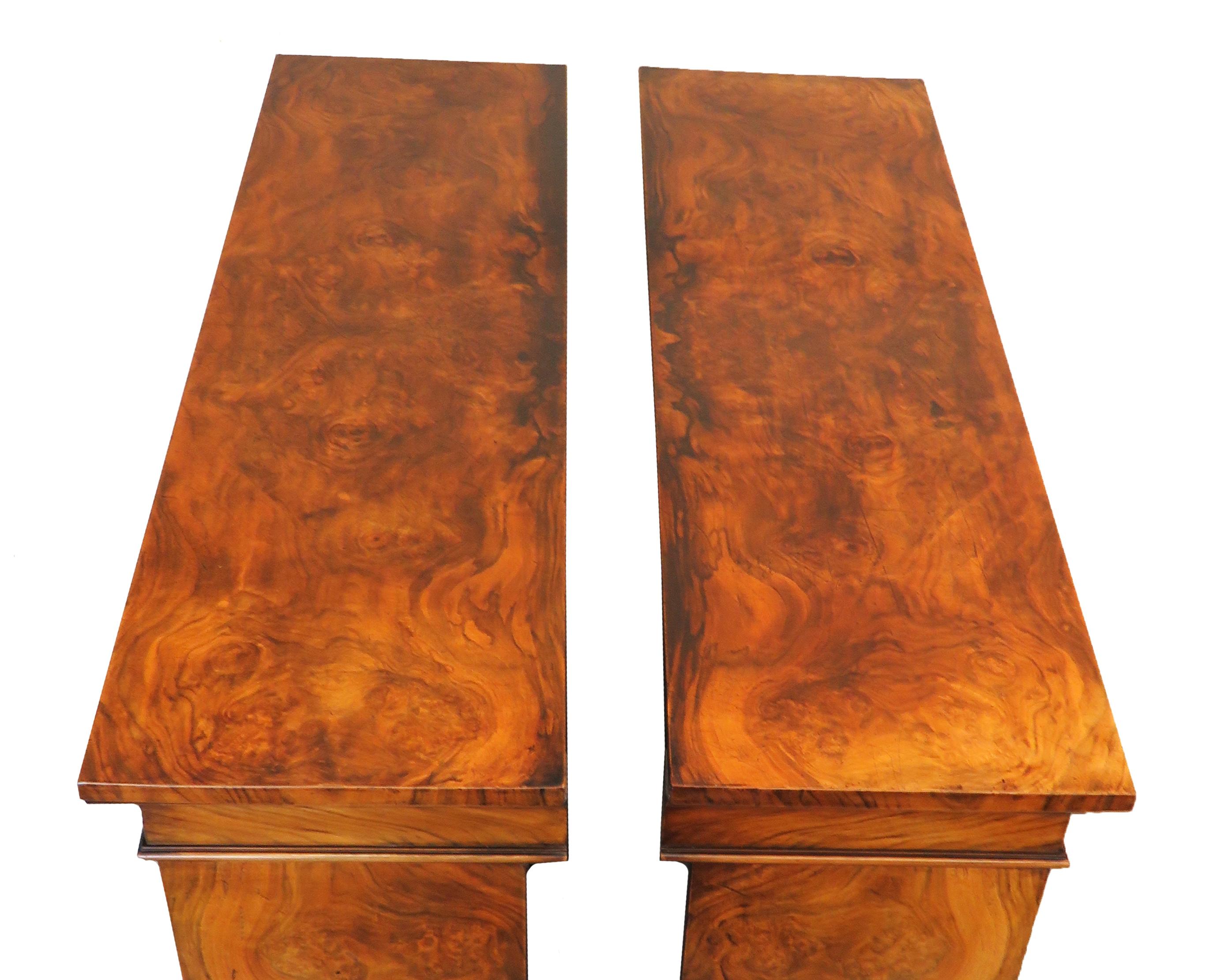 A fine quality pair of mid-19th century English burr walnut
dwarf open bookcases of good proportions having
superbly figured rectangular tops over adjustable
shelves and extremely well figured ends raised on
original plinth bases.

(These