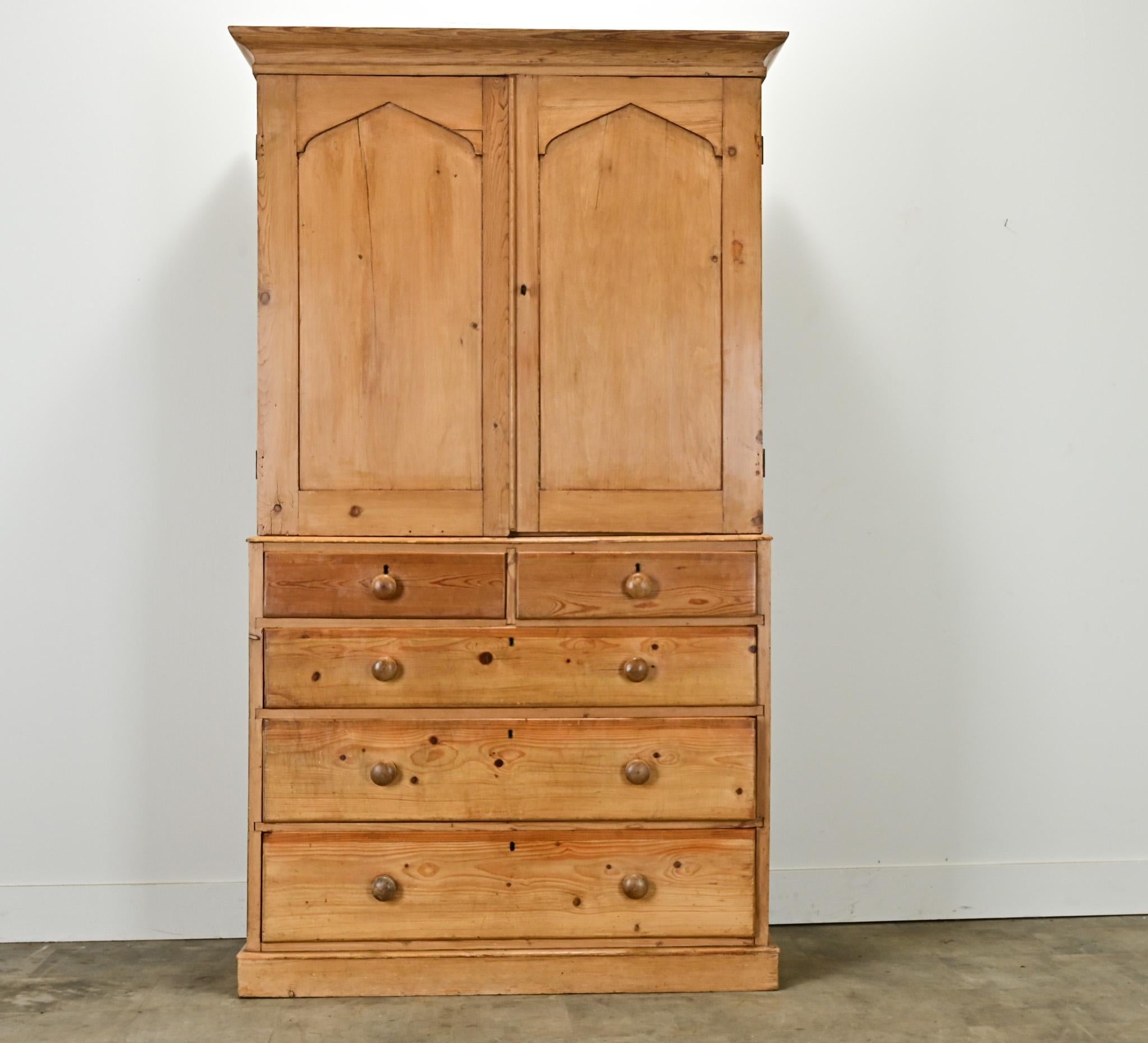 An English solid pine linen press made in the 1800’s. The top of this cabinet has two paneled doors opening with a working lock and key to an interior with a single 17 ½” deep fixed shelf. The original linen press shelves have been changed out over