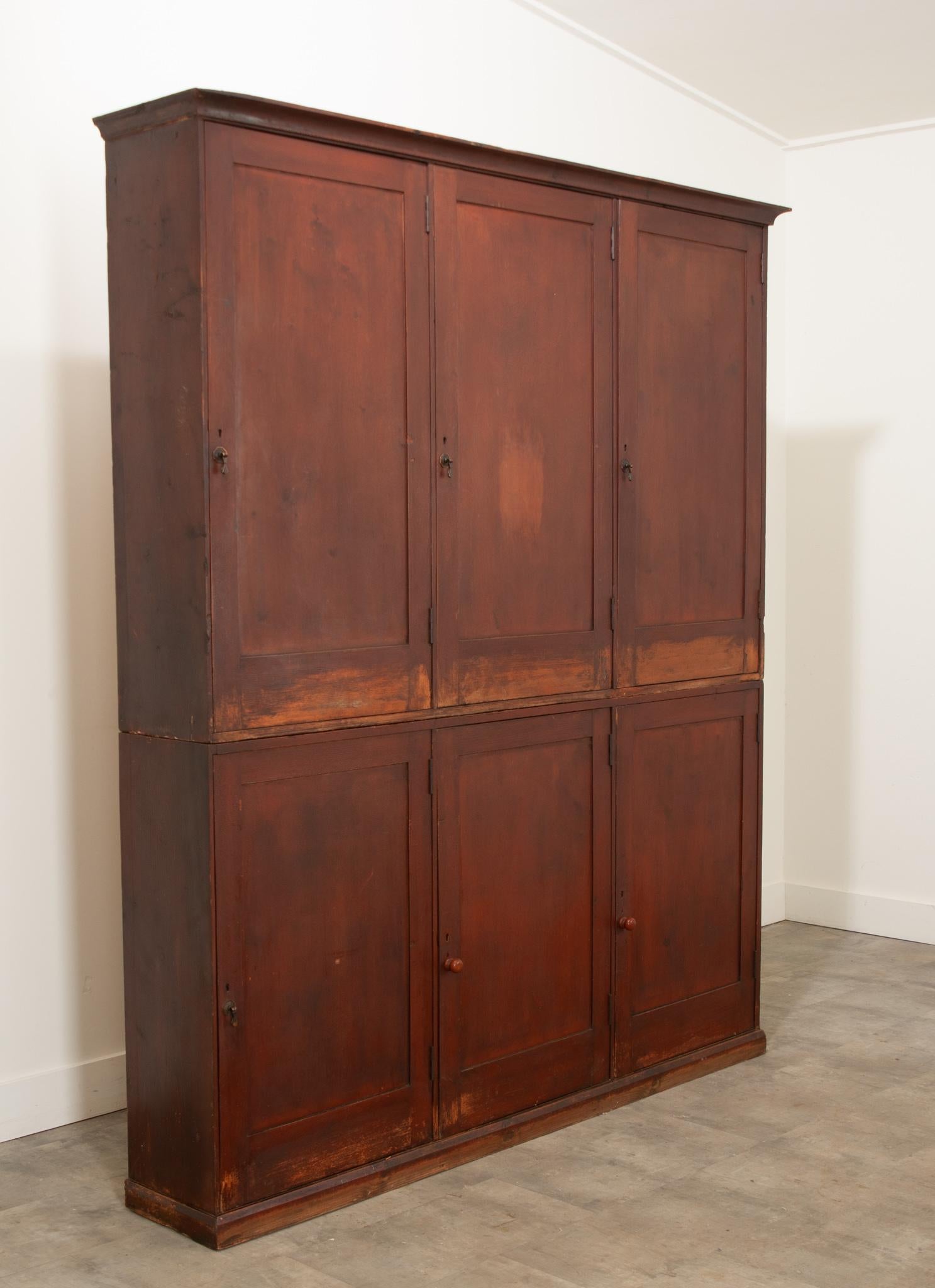 A unique 19th century butler’s pantry made in England circa 1860. Beautifully crafted of English pine, these Victorian era cupboards provide abundant storage with classic style. Featuring sets of three upper and lower cabinets with plenty of