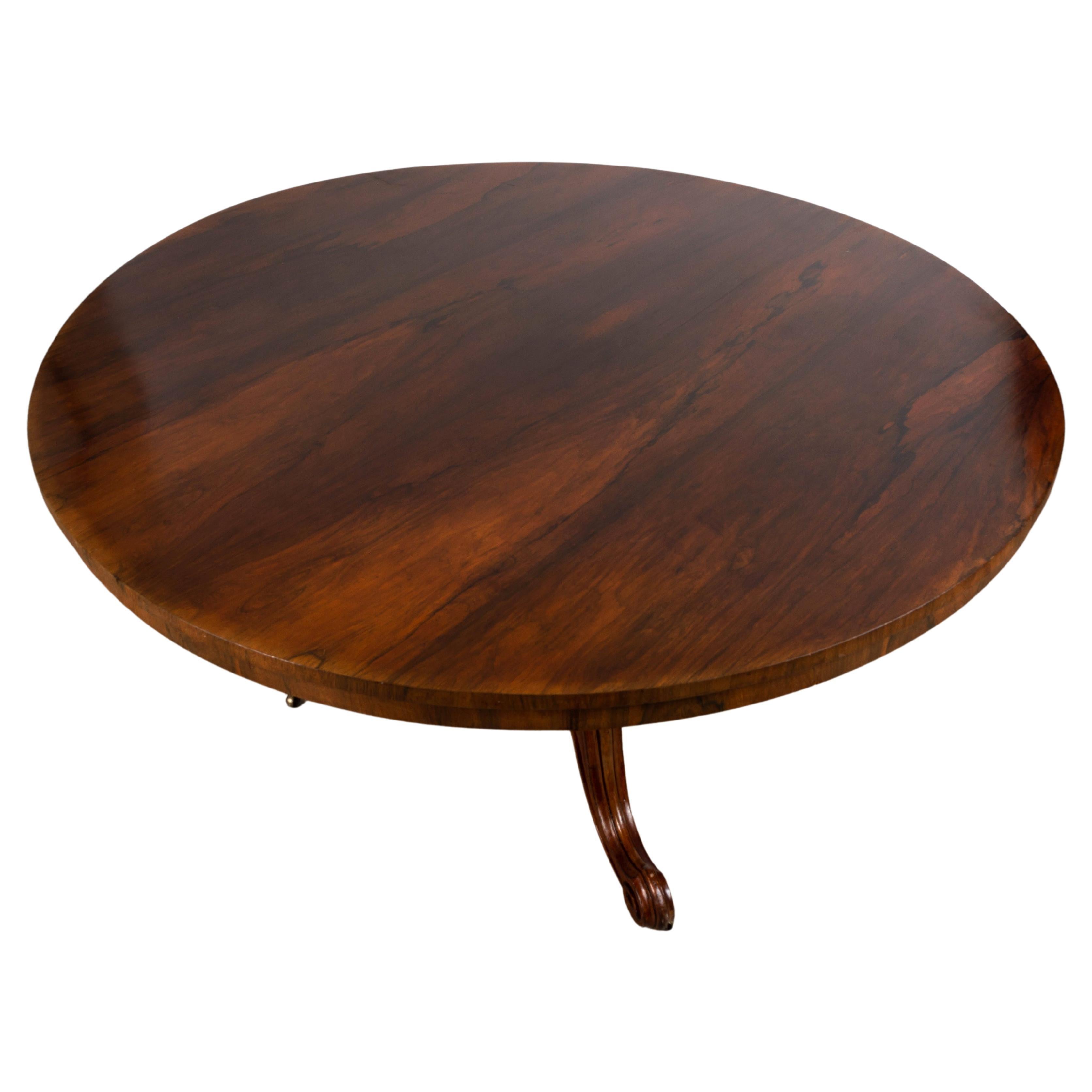 English 19th century Regency rosewood tilt top centre table, c.1830

A striking Regency rosewood tilt top centre/dining table. 
Standing on a bulbous pedestal and splayed cabriole legs terminating in castors. Of generous proportions, to seat six
